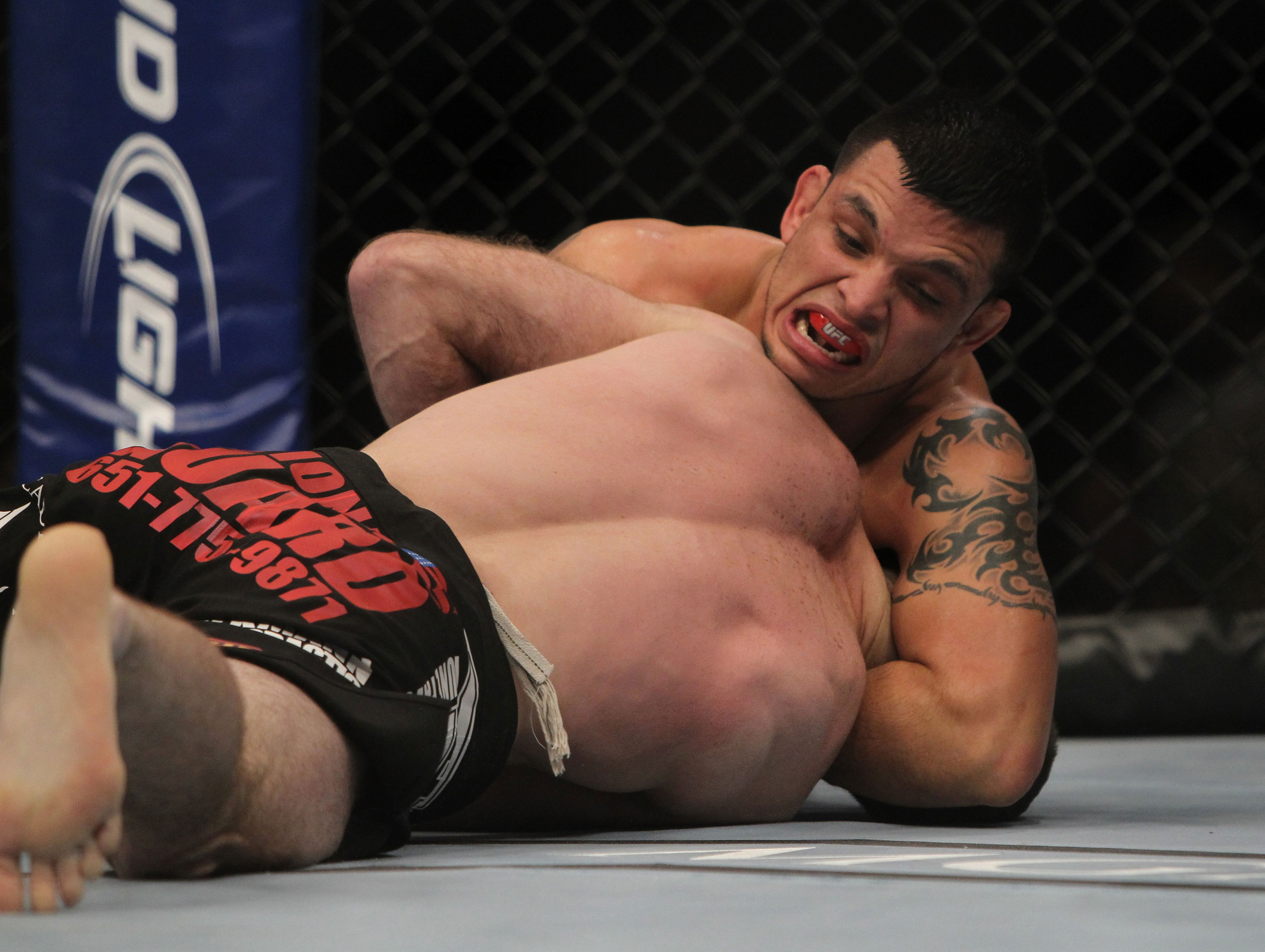 LAS VEGAS, NV - DECEMBER 30: Efrain Escudero (top) attempts to submit Jacob Volkmann during the UFC 141 event at the MGM Grand Garden Arena on December 30, 2011 in Las Vegas, Nevada. (Photo by Josh Hedges/Zuffa LLC/Zuffa LLC via Getty Images) *** Local Caption *** Efrain Escudero