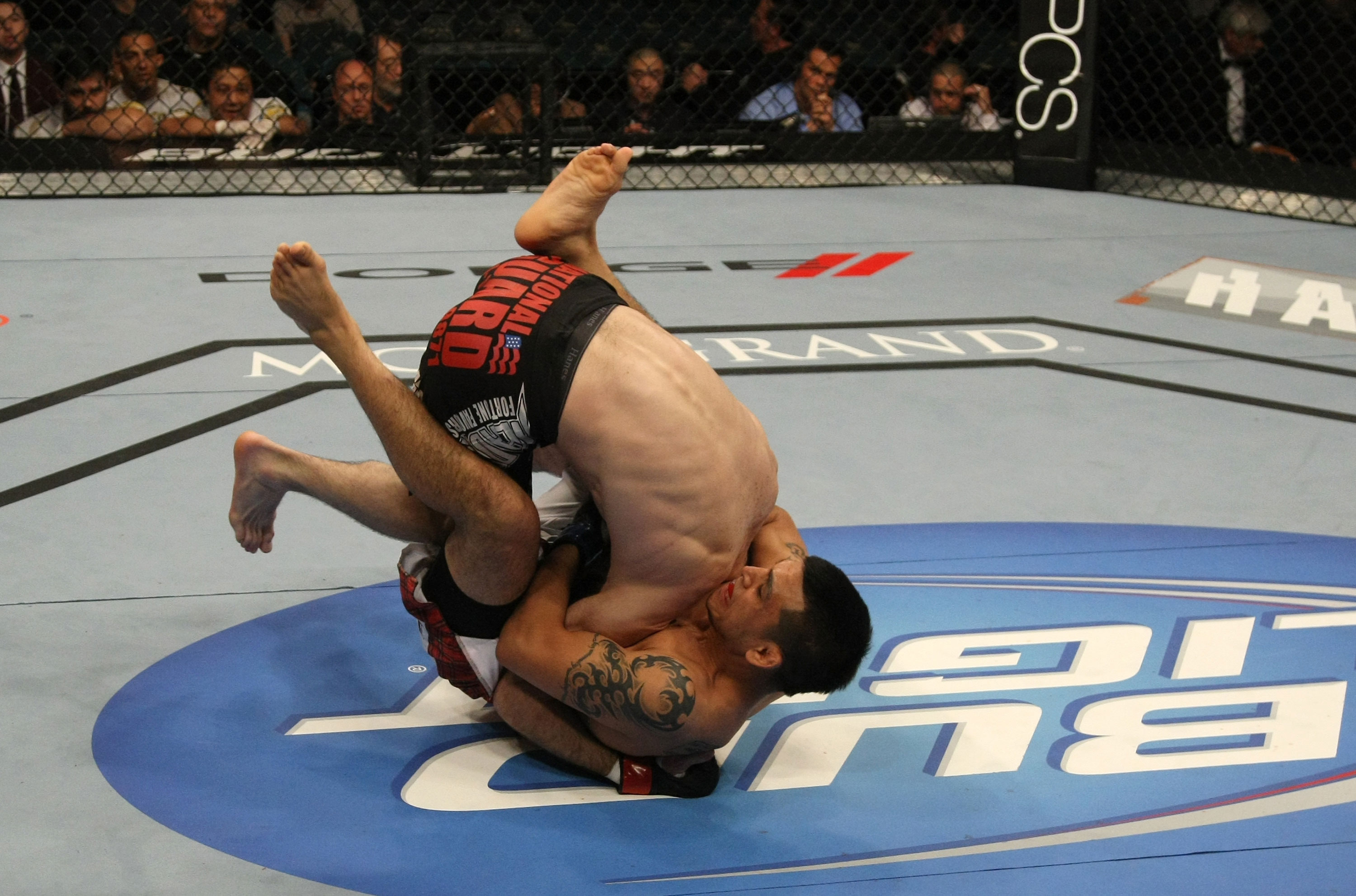LAS VEGAS, NV - DECEMBER 30: Efrain Escudero (bottom) attempts to submit Jacob Volkmann during the UFC 141 event at the MGM Grand Garden Arena on December 30, 2011 in Las Vegas, Nevada. (Photo by Donald Miralle/Zuffa LLC/Zuffa LLC via Getty Images) *** Local Caption *** Efrain Escudero; Jacob Volkmann