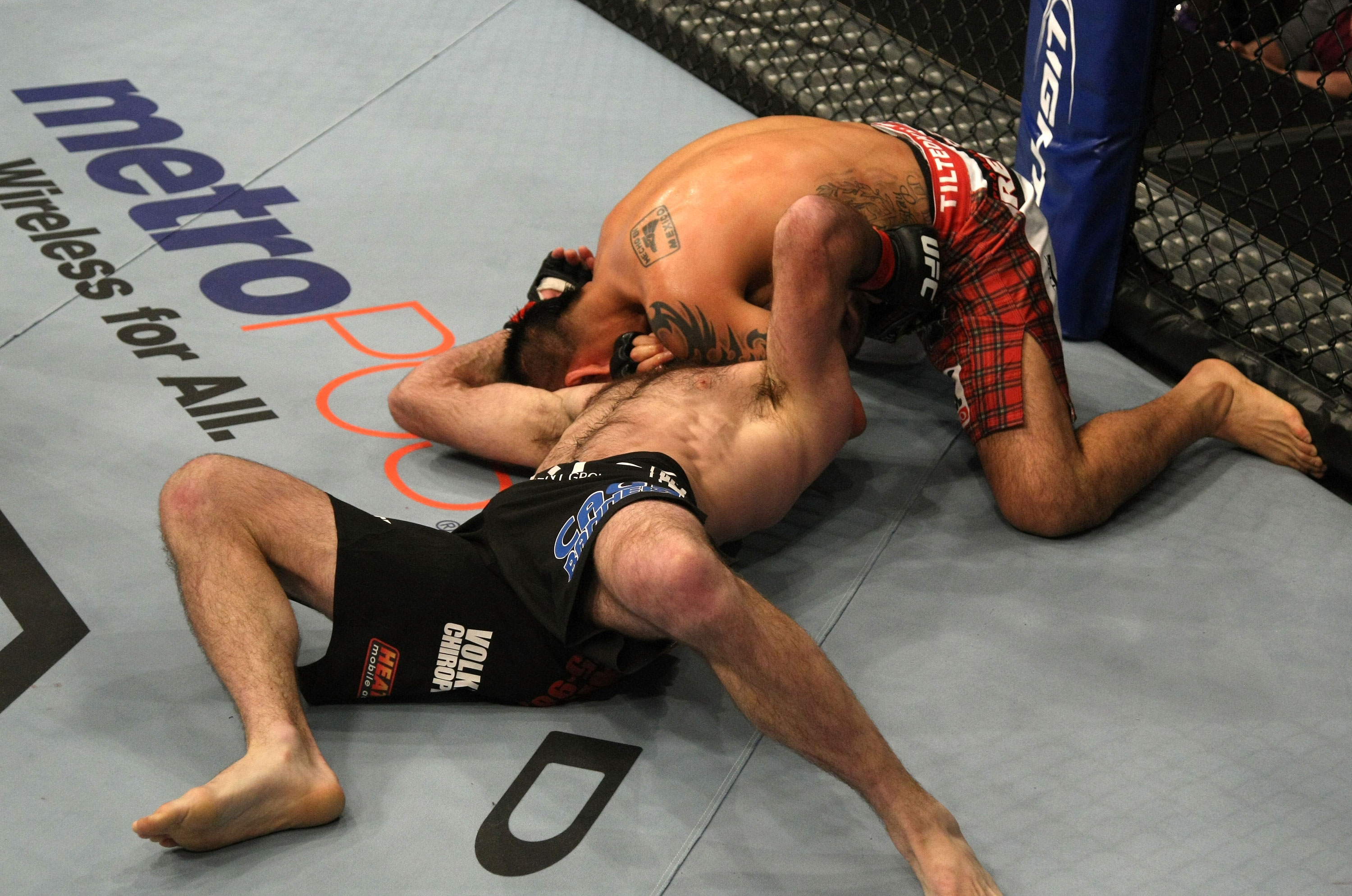 LAS VEGAS, NV - DECEMBER 30: Efrain Escudero (top) attempts to choke out Jacob Volkmann during the UFC 141 event at the MGM Grand Garden Arena on December 30, 2011 in Las Vegas, Nevada. (Photo by Donald Miralle/Zuffa LLC/Zuffa LLC via Getty Images) *** Local Caption *** Efrain Escudero; Jacob Volkmann