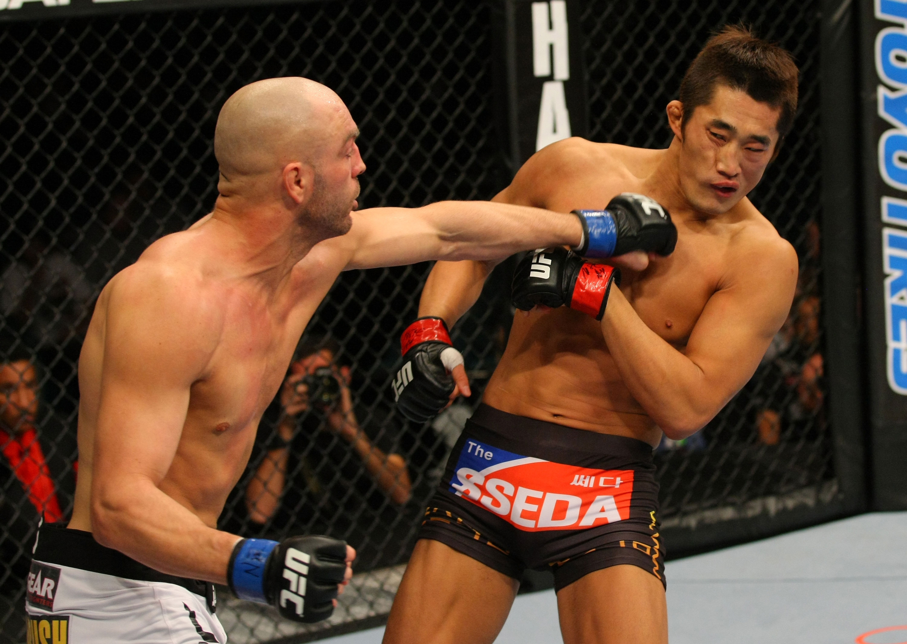LAS VEGAS, NV - DECEMBER 30: Sean Pierson (left) punches Dong Hyun Kim (right) during the UFC 141 event at the MGM Grand Garden Arena on December 30, 2011 in Las Vegas, Nevada. (Photo by Donald Miralle/Zuffa LLC/Zuffa LLC via Getty Images) *** Local Caption *** Sean Pierson; Dong Hyun Kim