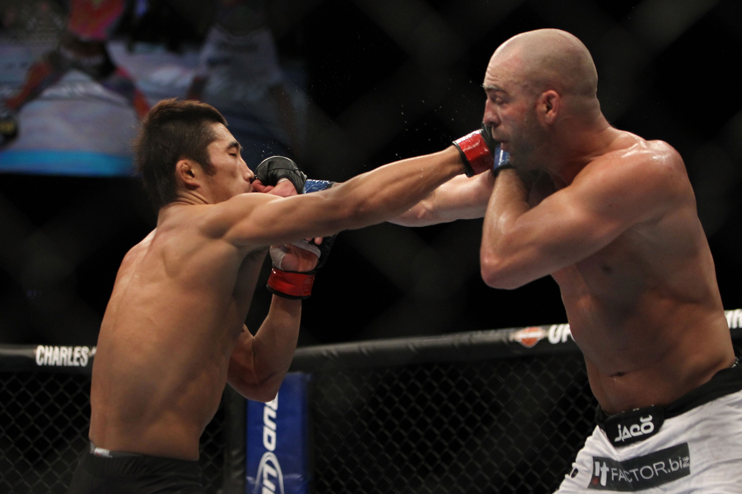 LAS VEGAS, NV - DECEMBER 30: Dong Hyun Kim (left) and Sean Pierson (right) exchange punches during the UFC 141 event at the MGM Grand Garden Arena on December 30, 2011 in Las Vegas, Nevada. (Photo by Josh Hedges/Zuffa LLC/Zuffa LLC via Getty Images) *** Local Caption *** Dong Hyun Kim; Sean Pierson