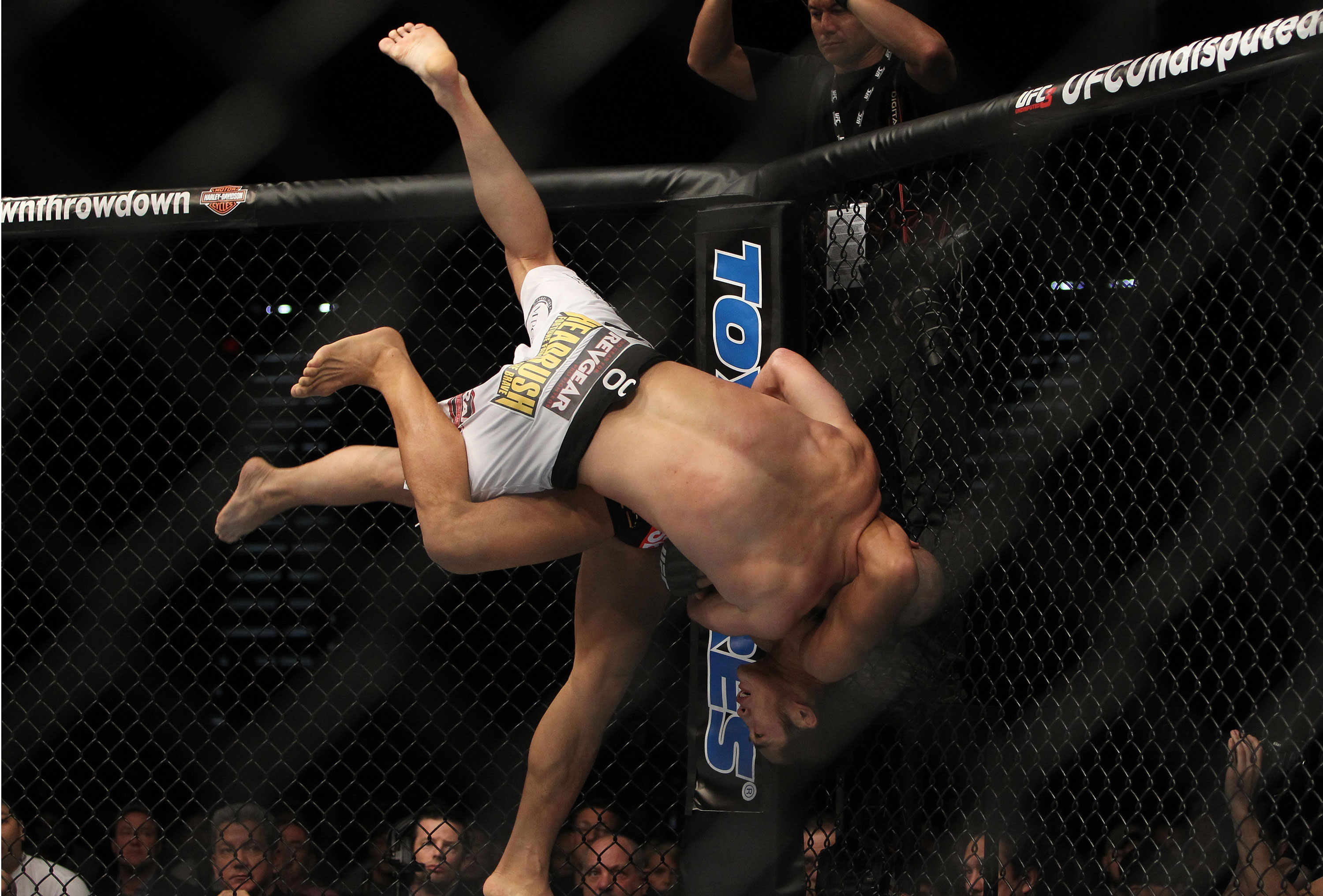 LAS VEGAS, NV - DECEMBER 30: Dong Hyun Kim throws Sean Pierson (white shorts) down to the canvas during the UFC 141 event at the MGM Grand Garden Arena on December 30, 2011 in Las Vegas, Nevada. (Photo by Josh Hedges/Zuffa LLC/Zuffa LLC via Getty Images) *** Local Caption *** Dong Hyun Kim; Sean Pierson