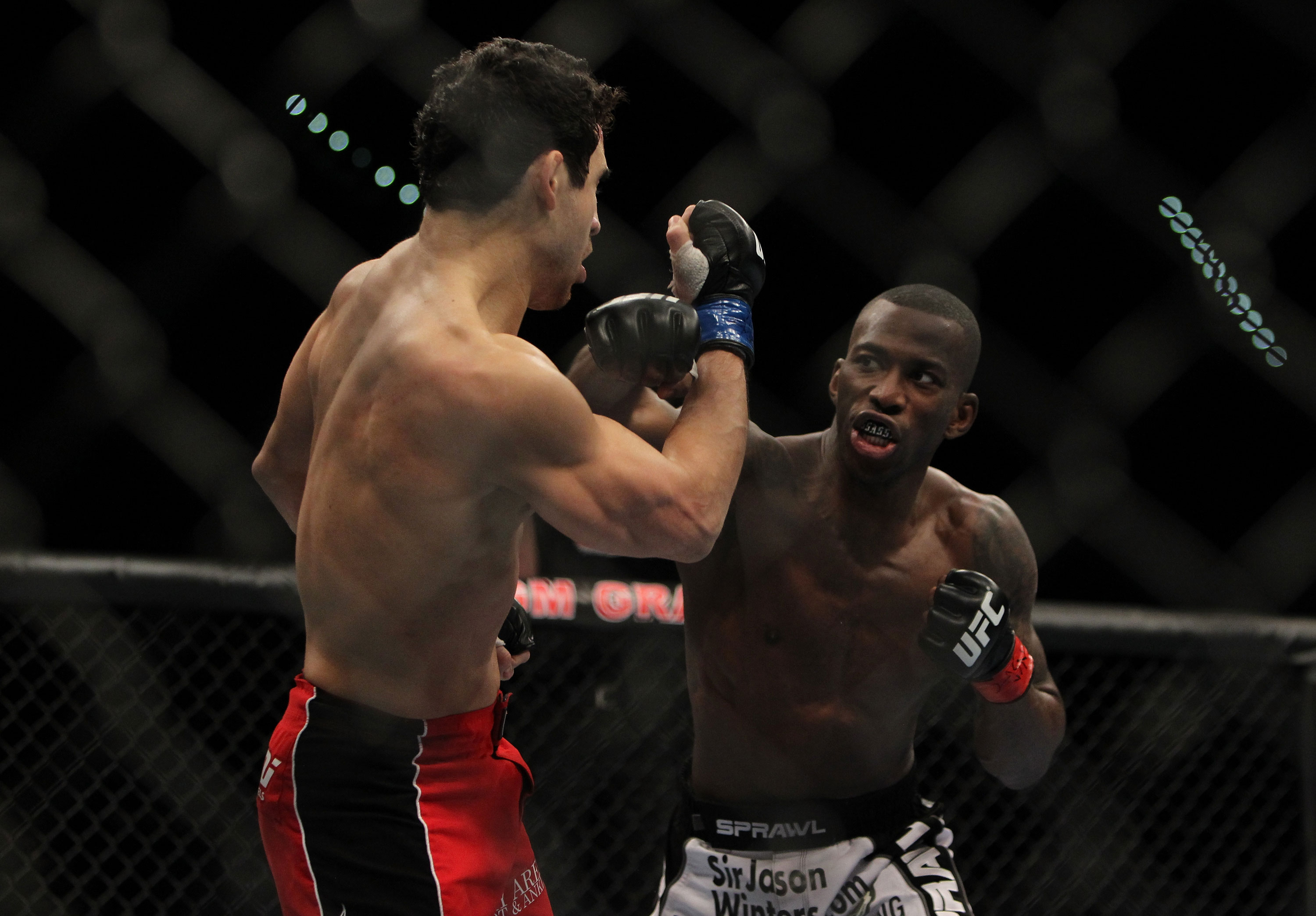 LAS VEGAS, NV - DECEMBER 30: Anthony Njokuani (right) throws a punch at Danny Castillo (left) during the UFC 141 event at the MGM Grand Garden Arena on December 30, 2011 in Las Vegas, Nevada. (Photo by Josh Hedges/Zuffa LLC/Zuffa LLC via Getty Images) *** Local Caption *** Anthony Njokuani; Danny Castillo
