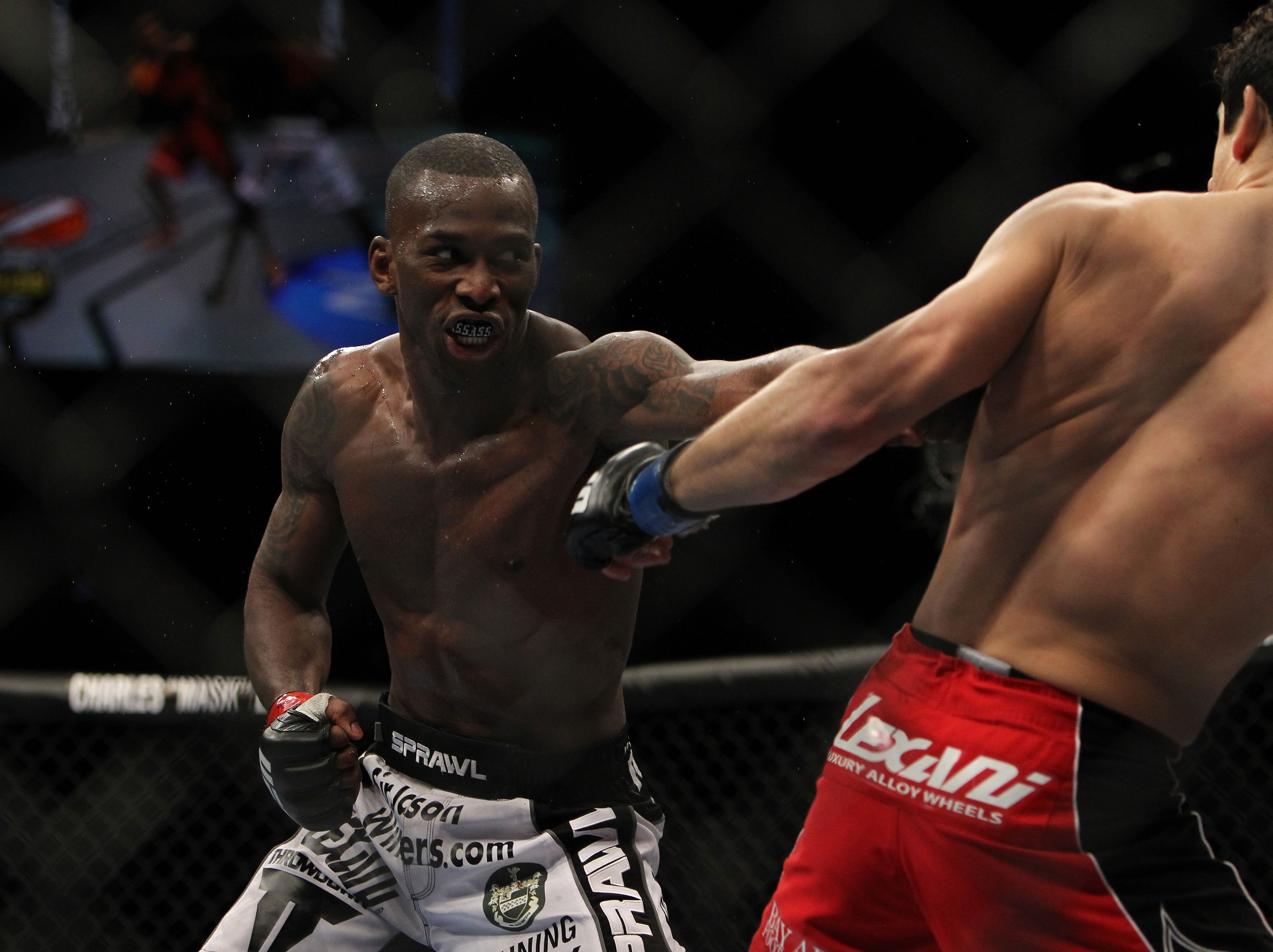 LAS VEGAS, NV - DECEMBER 30: Anthony Njokuani (left) punches Danny Castillo (right) during the UFC 141 event at the MGM Grand Garden Arena on December 30, 2011 in Las Vegas, Nevada. (Photo by Josh Hedges/Zuffa LLC/Zuffa LLC via Getty Images) *** Local Caption *** Anthony Njokuani; Danny Castillo