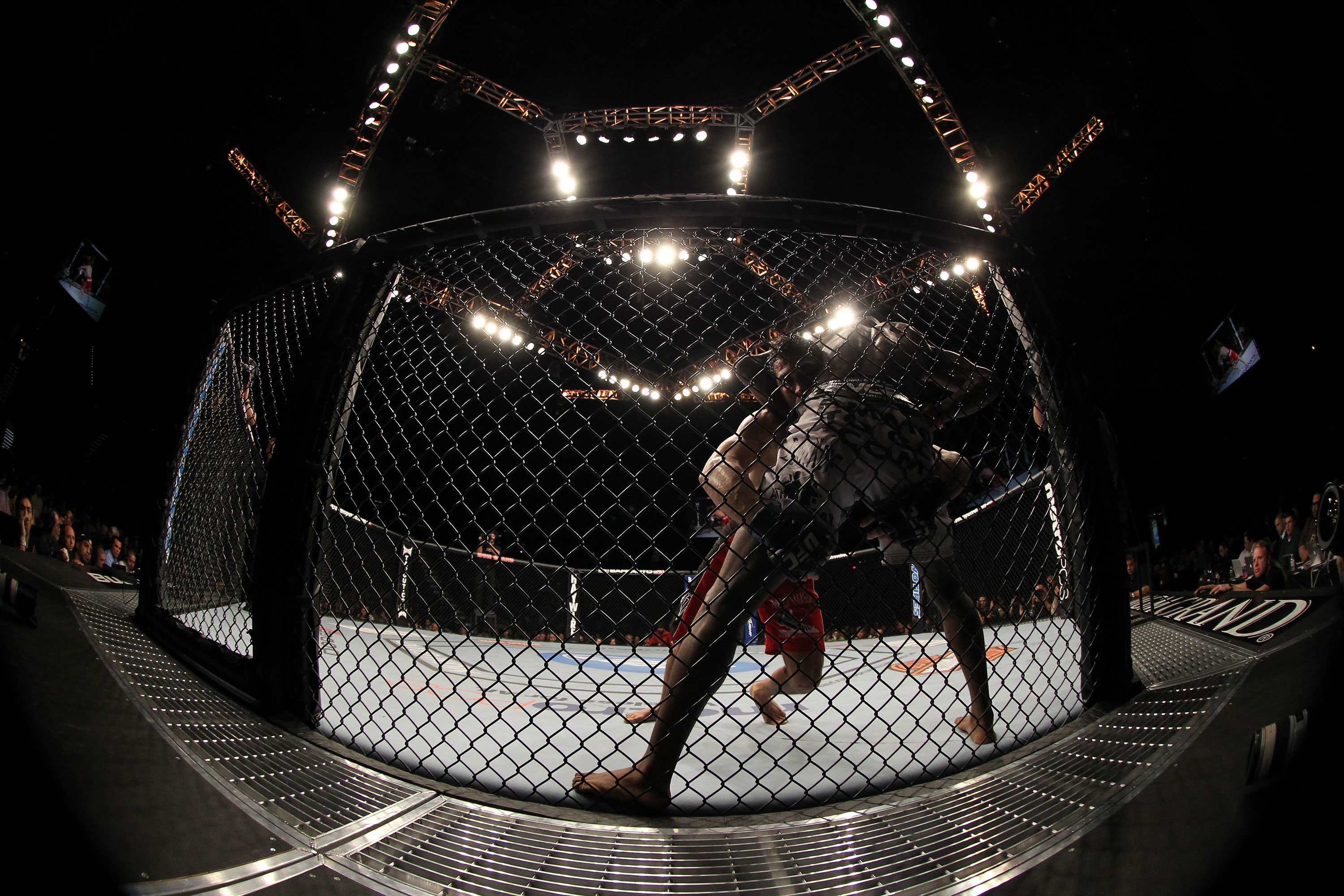 LAS VEGAS, NV - DECEMBER 30: Danny Castillo (red shorts) attempts to secure a takedown on Anthony Njokuani (white shorts) during the UFC 141 event at the MGM Grand Garden Arena on December 30, 2011 in Las Vegas, Nevada. (Photo by Josh Hedges/Zuffa LLC/Zuffa LLC via Getty Images) *** Local Caption *** Danny Castillo; Anthony Njokuani