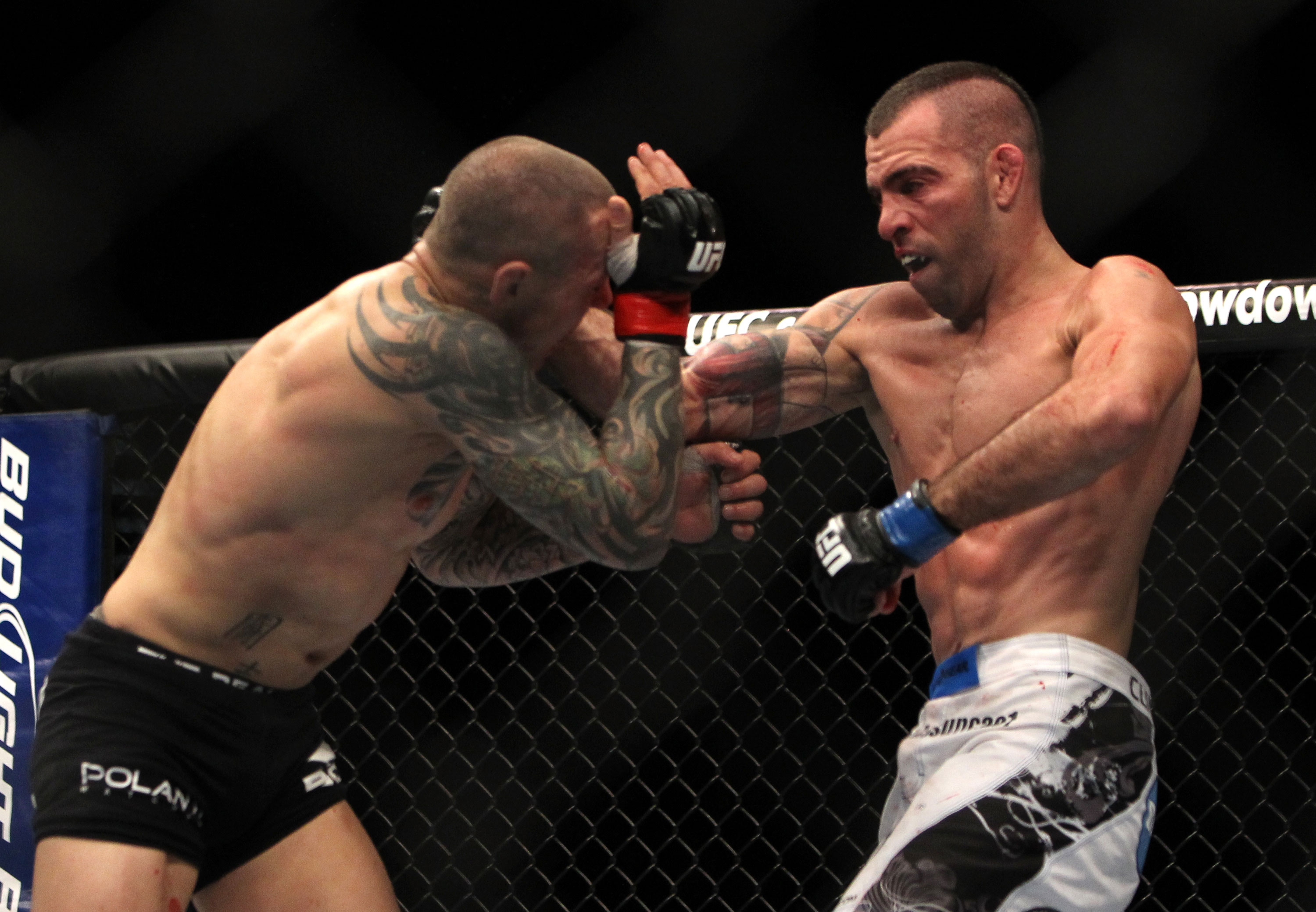 LAS VEGAS, NV - DECEMBER 30: Junior Assuncao (right) punches Ross Pearson during the UFC 141 event at the MGM Grand Garden Arena on December 30, 2011 in Las Vegas, Nevada. (Photo by Josh Hedges/Zuffa LLC/Zuffa LLC via Getty Images) *** Local Caption *** Junior Assuncao; Ross Pearson