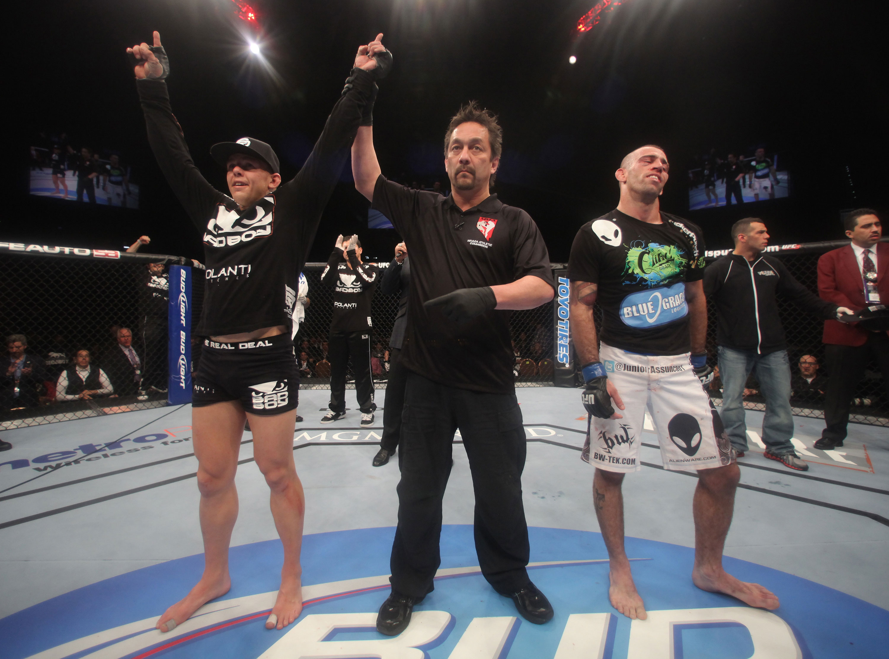 LAS VEGAS, NV - DECEMBER 30: Ross Pearson (left) is declared the winner over his opponent Junior Assuncao (right) during the UFC 141 event at the MGM Grand Garden Arena on December 30, 2011 in Las Vegas, Nevada. (Photo by Donald Miralle/Zuffa LLC/Zuffa LLC via Getty Images) *** Local Caption *** Ross Pearson; Junior Assuncao
