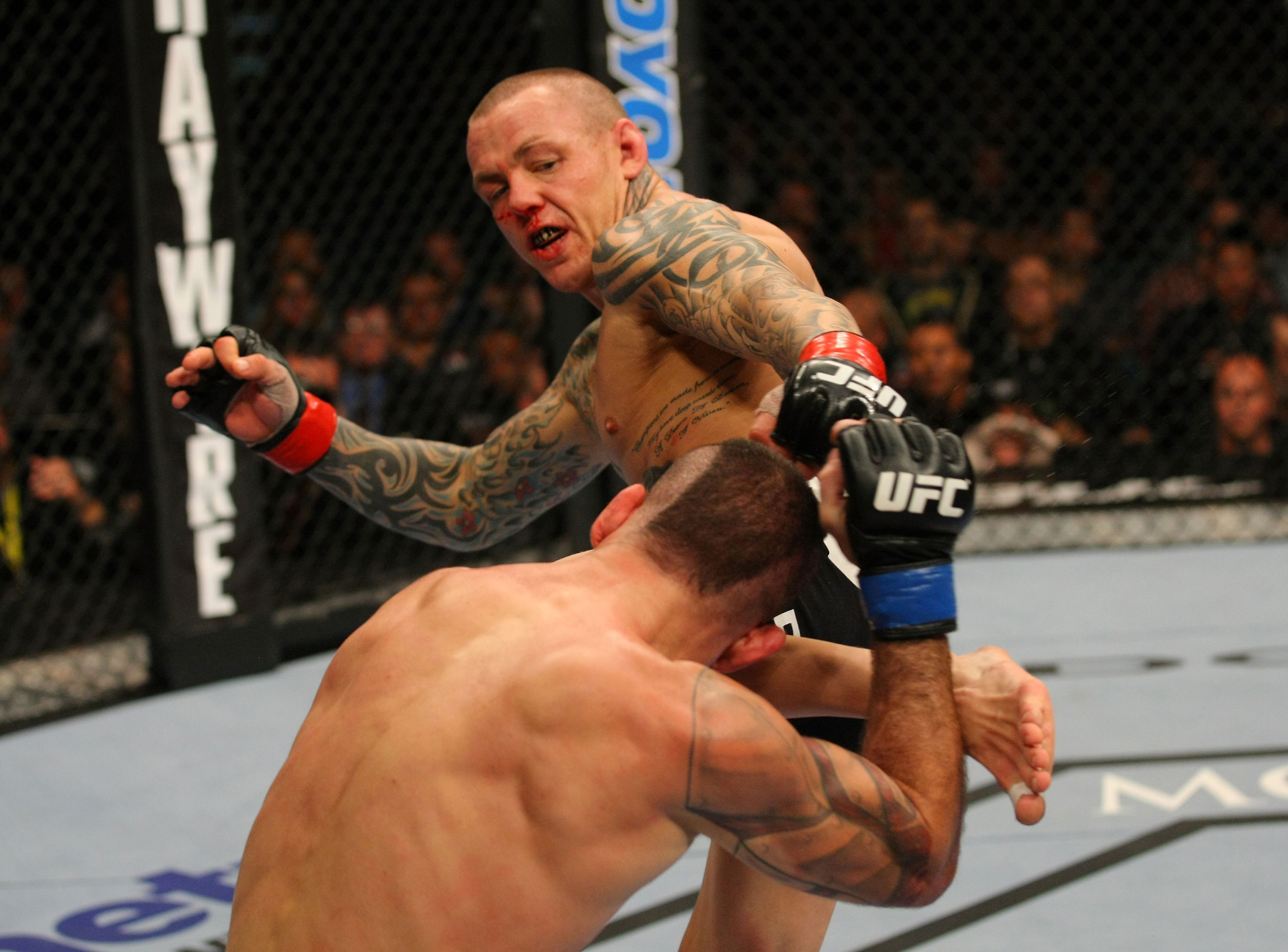 LAS VEGAS, NV - DECEMBER 30: Ross Pearson (top) kicks Junior Assuncao during the UFC 141 event at the MGM Grand Garden Arena on December 30, 2011 in Las Vegas, Nevada. (Photo by Donald Miralle/Zuffa LLC/Zuffa LLC via Getty Images) *** Local Caption *** Ross Pearson; Junior Assuncao