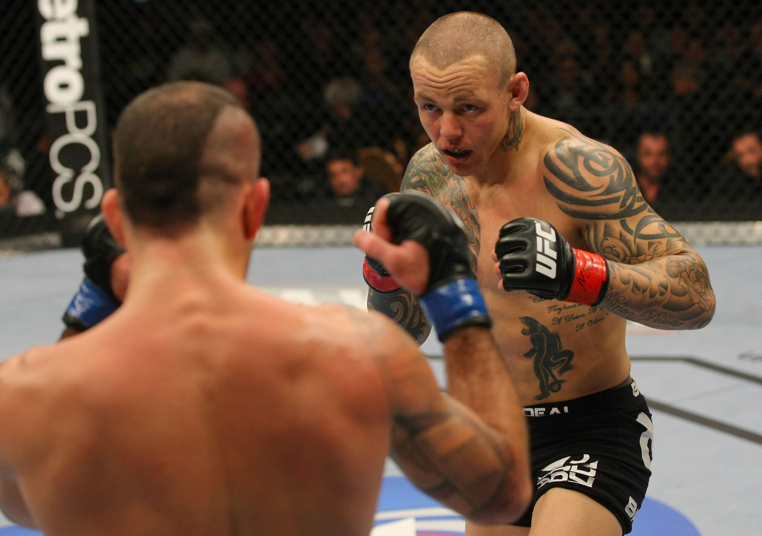 LAS VEGAS, NV - DECEMBER 30: Ross Pearson (black shorts) and Junior Assuncao square off during the UFC 141 event at the MGM Grand Garden Arena on December 30, 2011 in Las Vegas, Nevada. (Photo by Donald Miralle/Zuffa LLC/Zuffa LLC via Getty Images) *** Local Caption *** Ross Pearson; Junior Assuncao