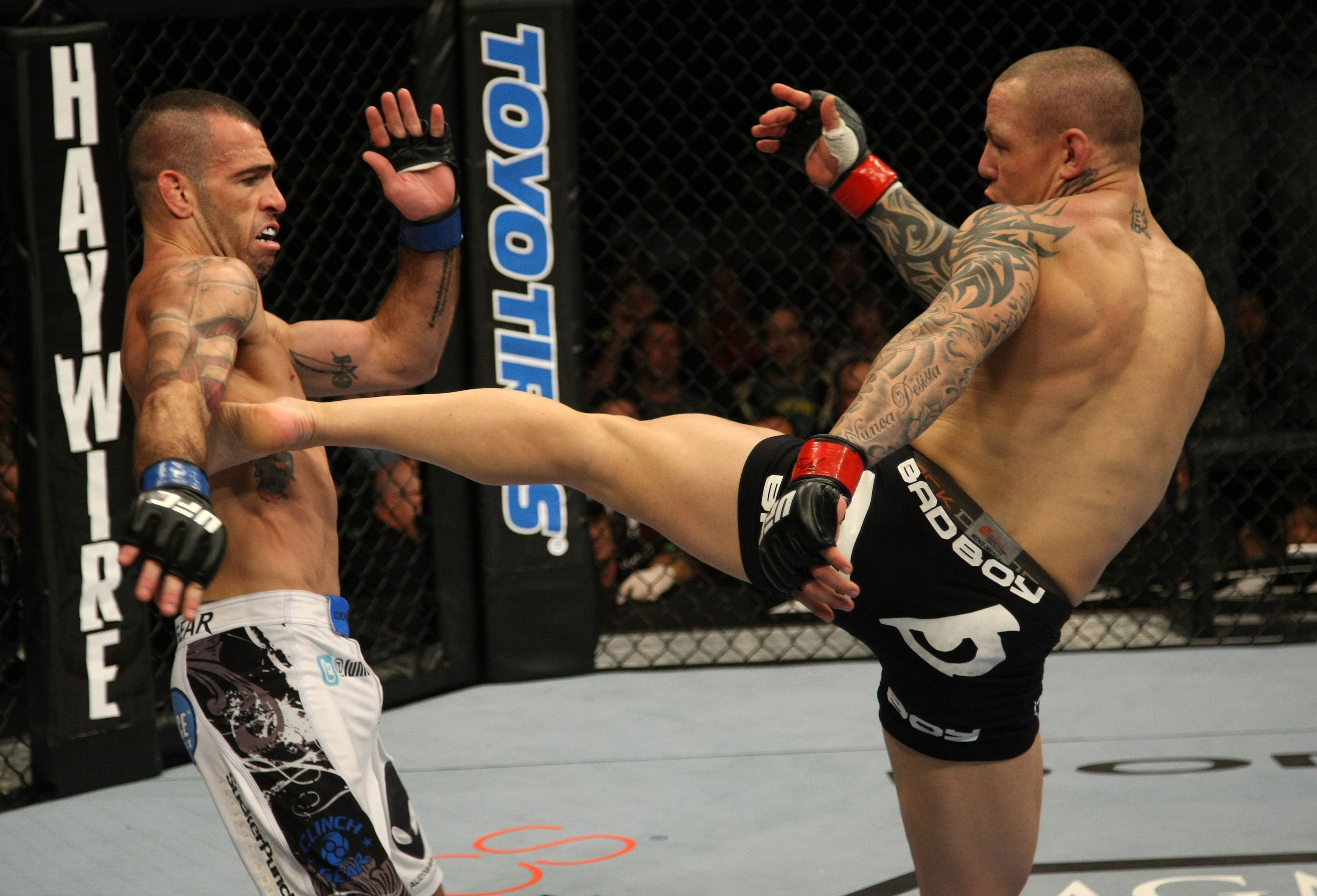 LAS VEGAS, NV - DECEMBER 30: Ross Pearson (right) kicks Junior Assuncao (left) during the UFC 141 event at the MGM Grand Garden Arena on December 30, 2011 in Las Vegas, Nevada. (Photo by Donald Miralle/Zuffa LLC/Zuffa LLC via Getty Images) *** Local Caption *** Ross Pearson; Junior Assuncao