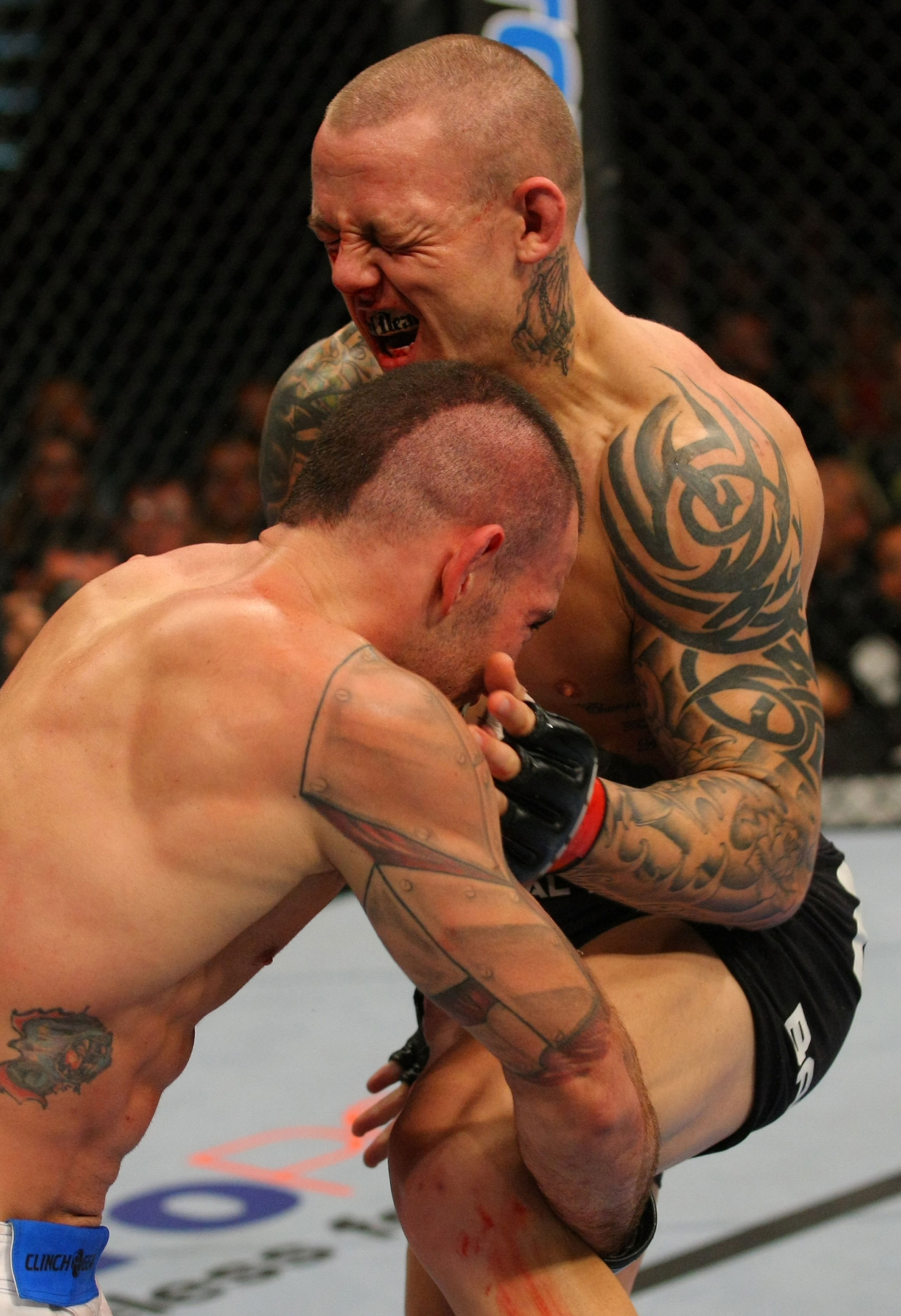 LAS VEGAS, NV - DECEMBER 30: Ross Pearson (right) blocks a takedown attempt from Junior Assuncao during the UFC 141 event at the MGM Grand Garden Arena on December 30, 2011 in Las Vegas, Nevada. (Photo by Donald Miralle/Zuffa LLC/Zuffa LLC via Getty Images) *** Local Caption *** Ross Pearson; Junior Assuncao