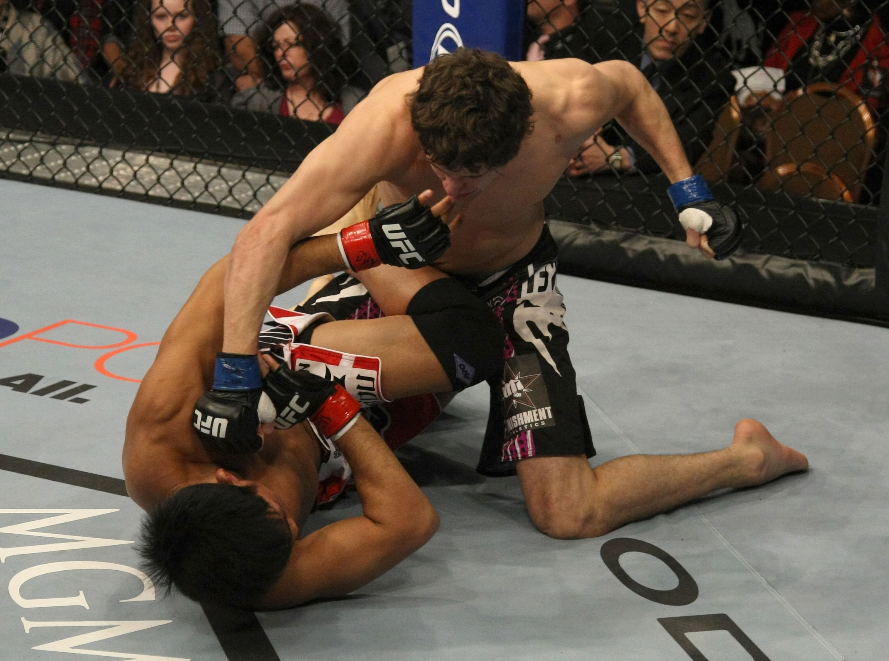 LAS VEGAS, NV - DECEMBER 30: Jimy Hettes (top) punches Nam Phan during the UFC 141 event at the MGM Grand Garden Arena on December 30, 2011 in Las Vegas, Nevada. (Photo by Donald Miralle/Zuffa LLC/Zuffa LLC via Getty Images) *** Local Caption *** Jimy Hettes; Nam Phan