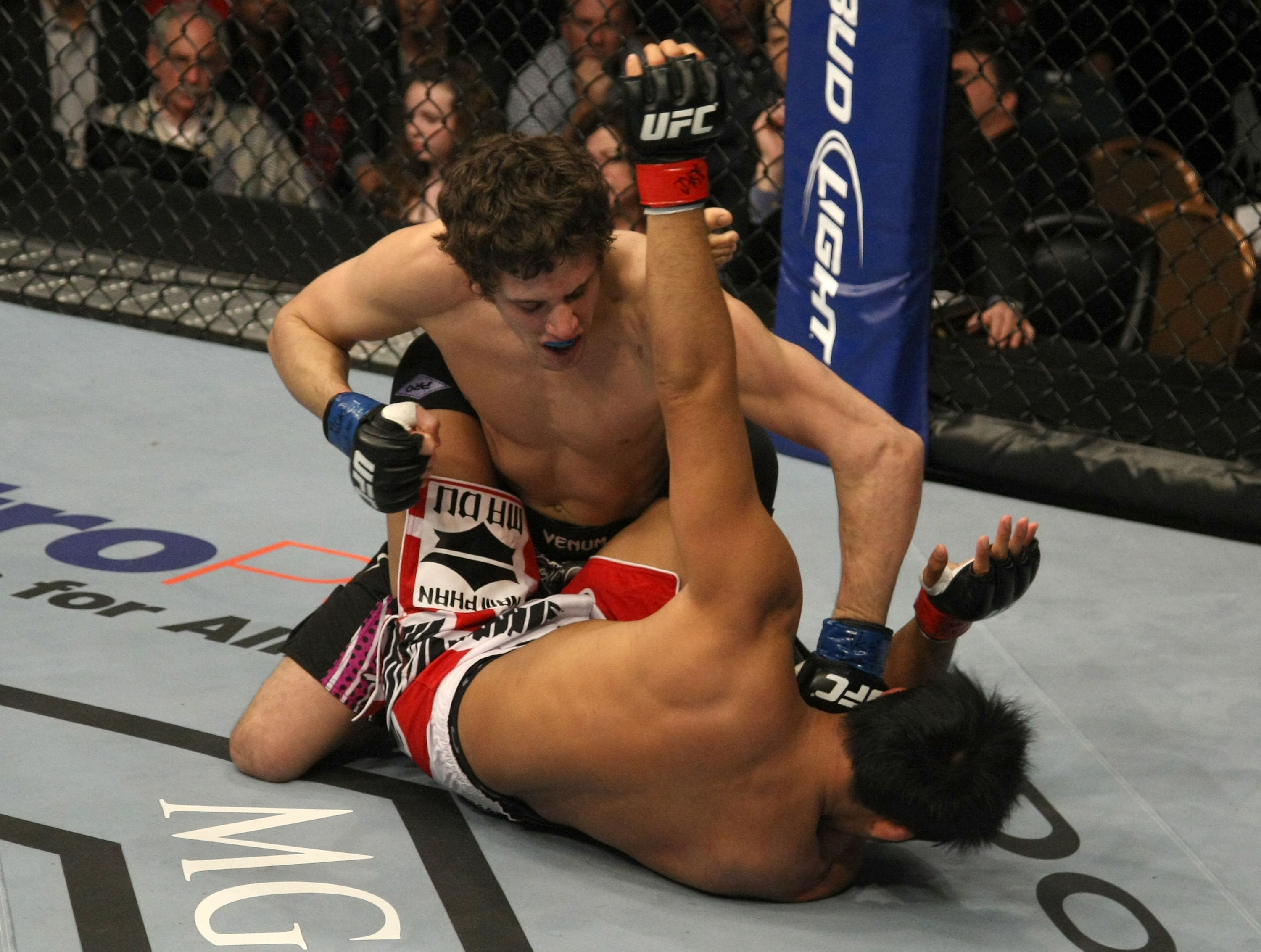LAS VEGAS, NV - DECEMBER 30: Jimy Hettes (top) punches Nam Phan during the UFC 141 event at the MGM Grand Garden Arena on December 30, 2011 in Las Vegas, Nevada. (Photo by Donald Miralle/Zuffa LLC/Zuffa LLC via Getty Images) *** Local Caption *** Jimy Hettes; Nam Phan