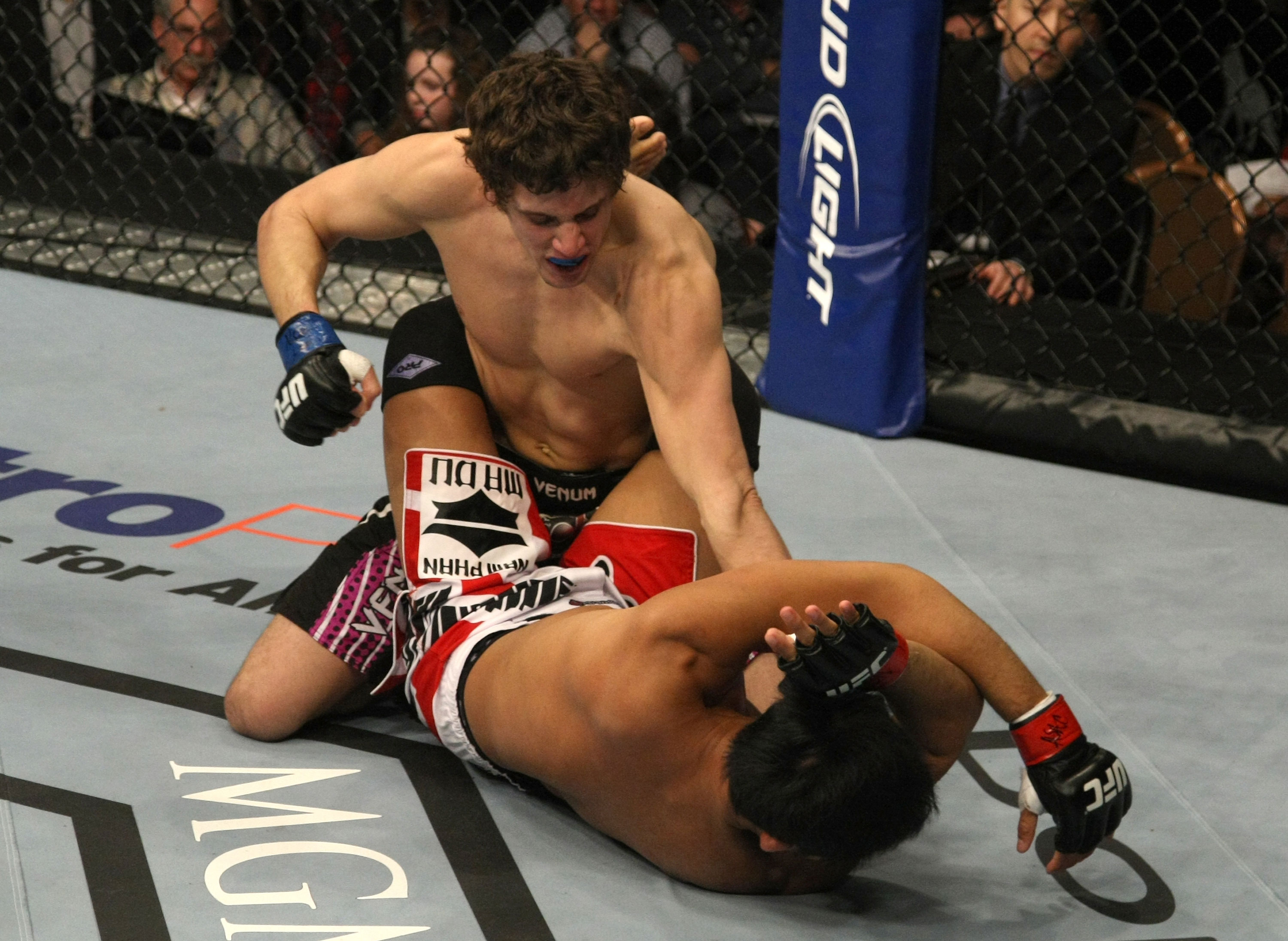 LAS VEGAS, NV - DECEMBER 30: Jimy Hettes (top) punches Nam Phan during the UFC 141 event at the MGM Grand Garden Arena on December 30, 2011 in Las Vegas, Nevada. (Photo by Donald Miralle/Zuffa LLC/Zuffa LLC via Getty Images) *** Local Caption *** Jimy Hettes; Nam Phan