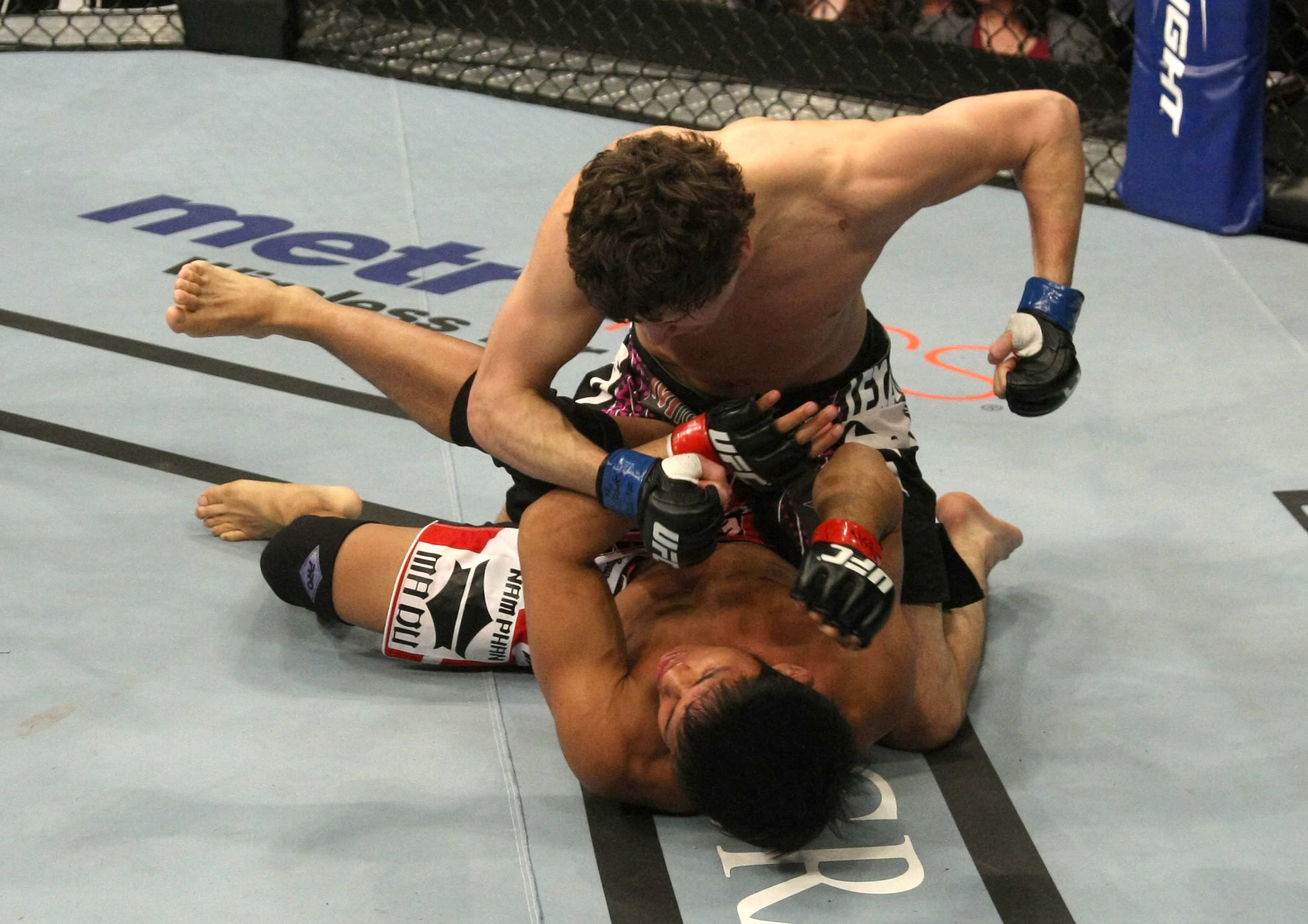 LAS VEGAS, NV - DECEMBER 30: Jimy Hettes (top) punches Nam Phan during the UFC 141 event at the MGM Grand Garden Arena on December 30, 2011 in Las Vegas, Nevada. (Photo by Donald Miralle/Zuffa LLC/Zuffa LLC via Getty Images) *** Local Caption *** Jimy Hettes; Nam Phan