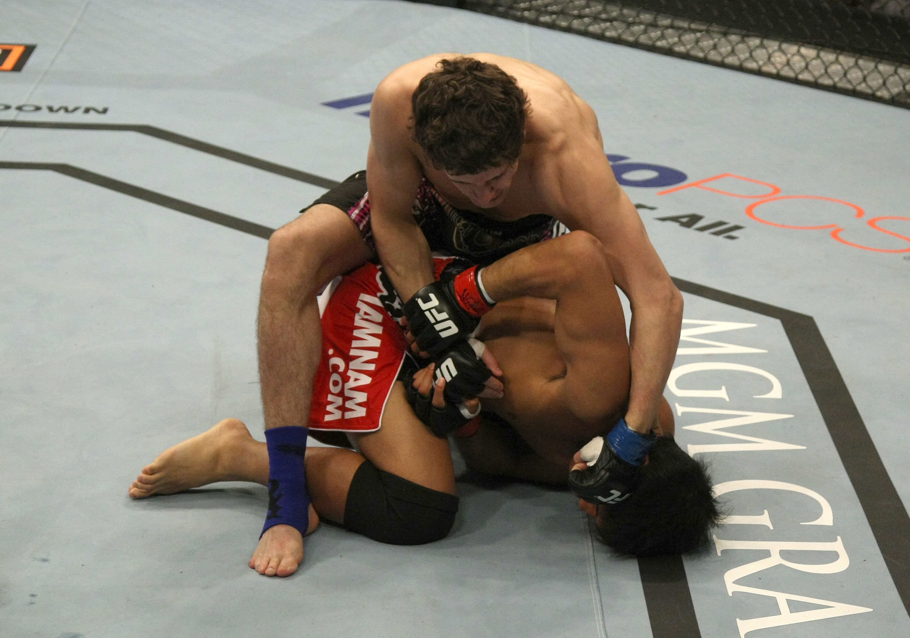 LAS VEGAS, NV - DECEMBER 30: Jimy Hettes (top) punches Nam Phan during the UFC 141 event at the MGM Grand Garden Arena on December 30, 2011 in Las Vegas, Nevada. (Photo by Donald Miralle/Zuffa LLC/Zuffa LLC via Getty Images) *** Local Caption *** Jimy Hettes; Nam Phan