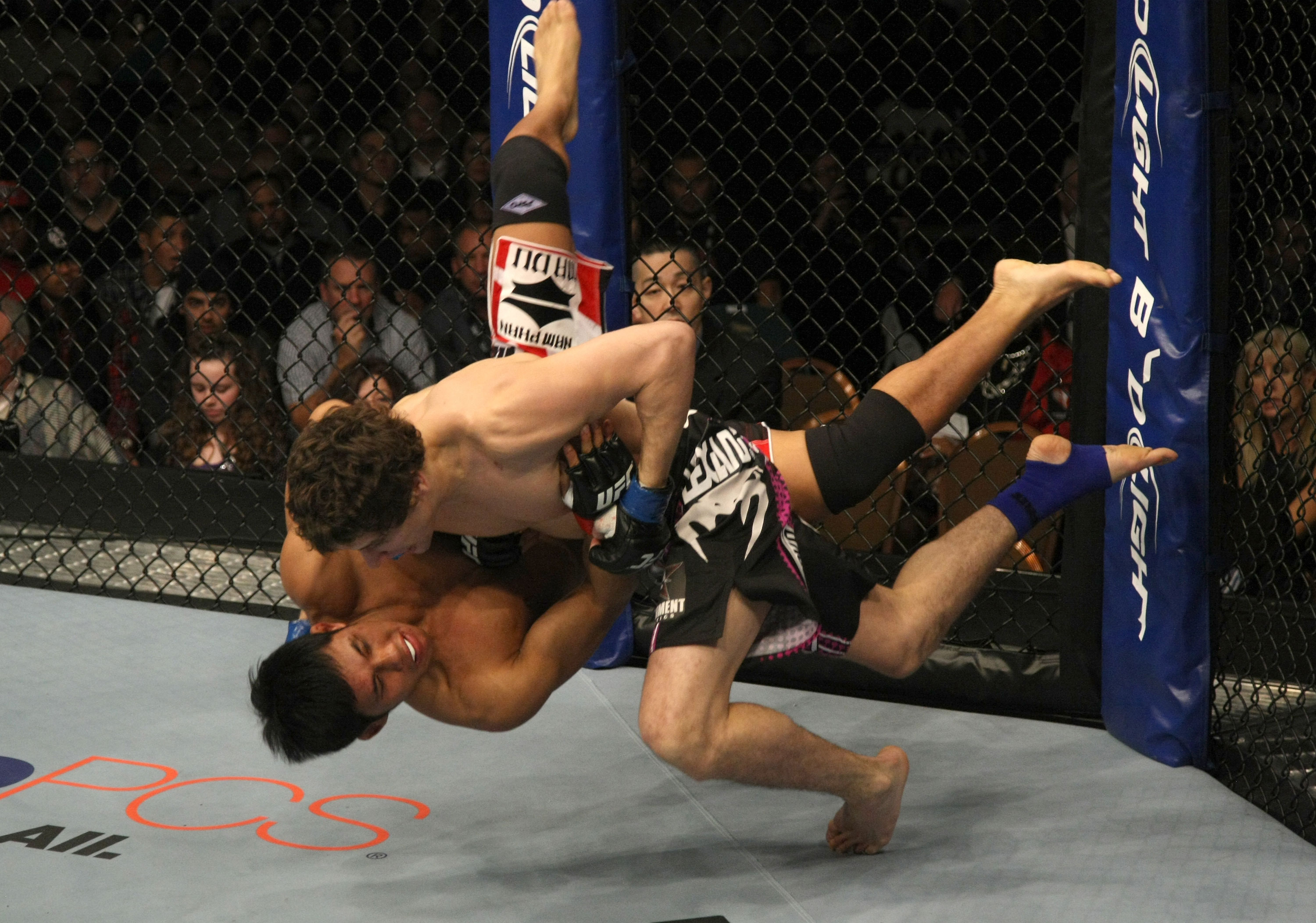 LAS VEGAS, NV - DECEMBER 30: Jimy Hettes (black shorts) slams Nam Phan during the UFC 141 event at the MGM Grand Garden Arena on December 30, 2011 in Las Vegas, Nevada. (Photo by Donald Miralle/Zuffa LLC/Zuffa LLC via Getty Images) *** Local Caption *** Jimy Hettes; Nam Phan