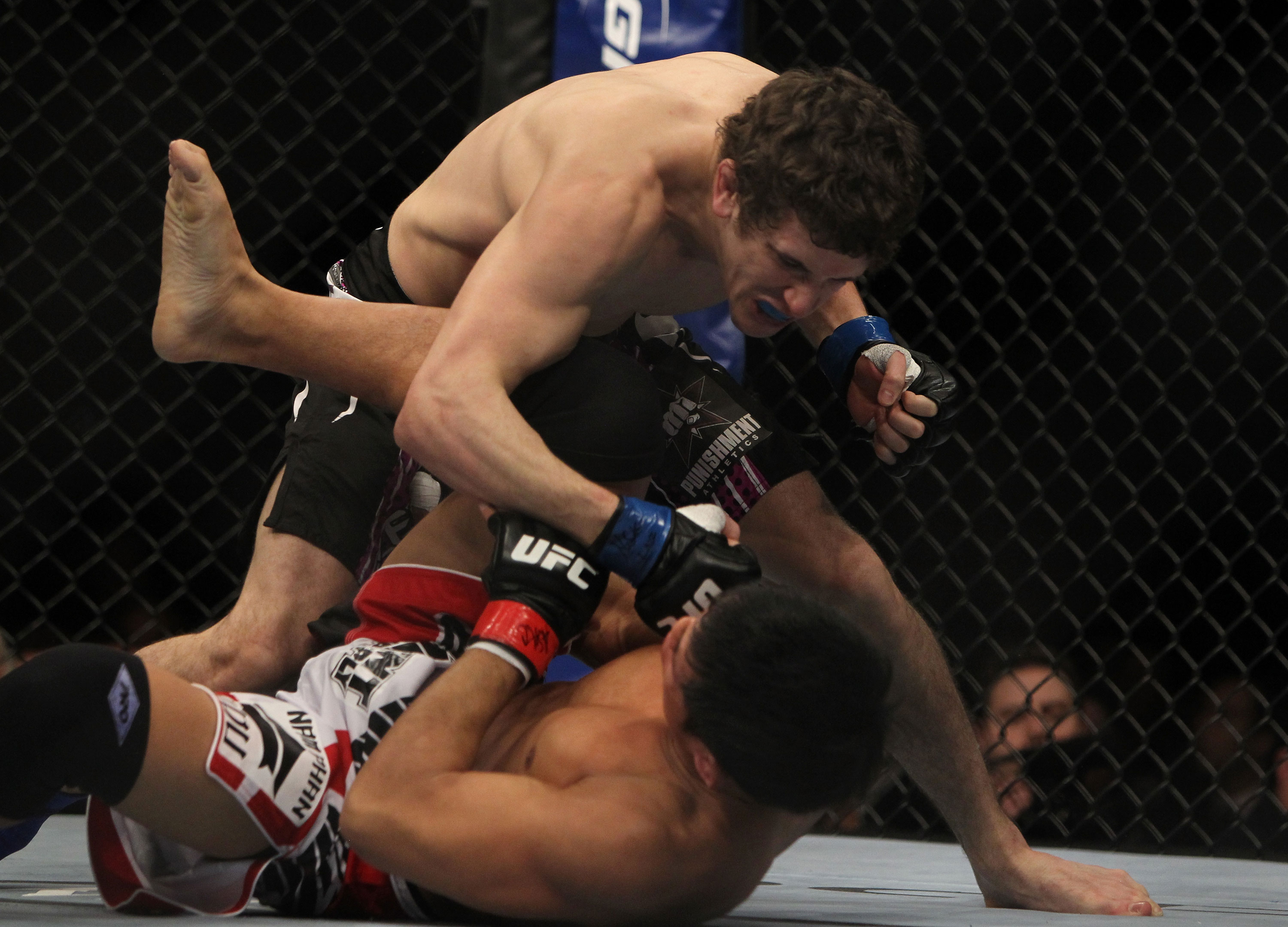LAS VEGAS, NV - DECEMBER 30: Jimy Hettes (top) punches Nam Phan during the UFC 141 event at the MGM Grand Garden Arena on December 30, 2011 in Las Vegas, Nevada. (Photo by Josh Hedges/Zuffa LLC/Zuffa LLC via Getty Images) *** Local Caption *** Jimy Hettes; Nam Phan
