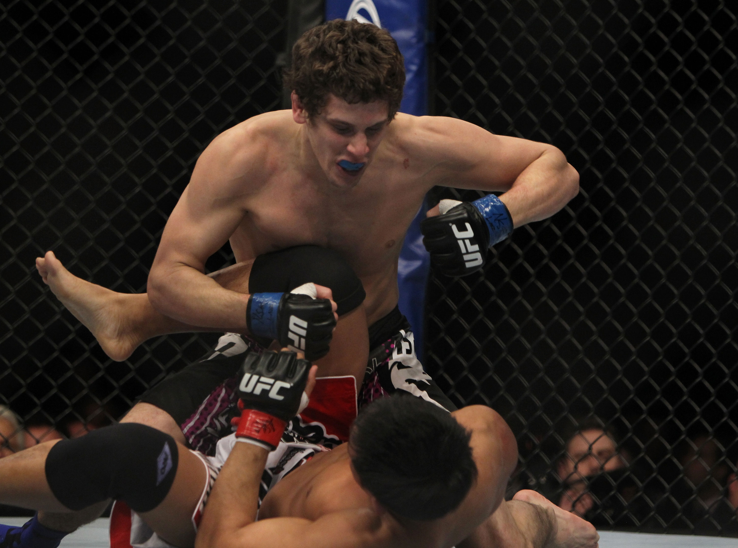 LAS VEGAS, NV - DECEMBER 30: Jimy Hettes (top) punches Nam Phan during the UFC 141 event at the MGM Grand Garden Arena on December 30, 2011 in Las Vegas, Nevada. (Photo by Josh Hedges/Zuffa LLC/Zuffa LLC via Getty Images) *** Local Caption *** Jimy Hettes; Nam Phan