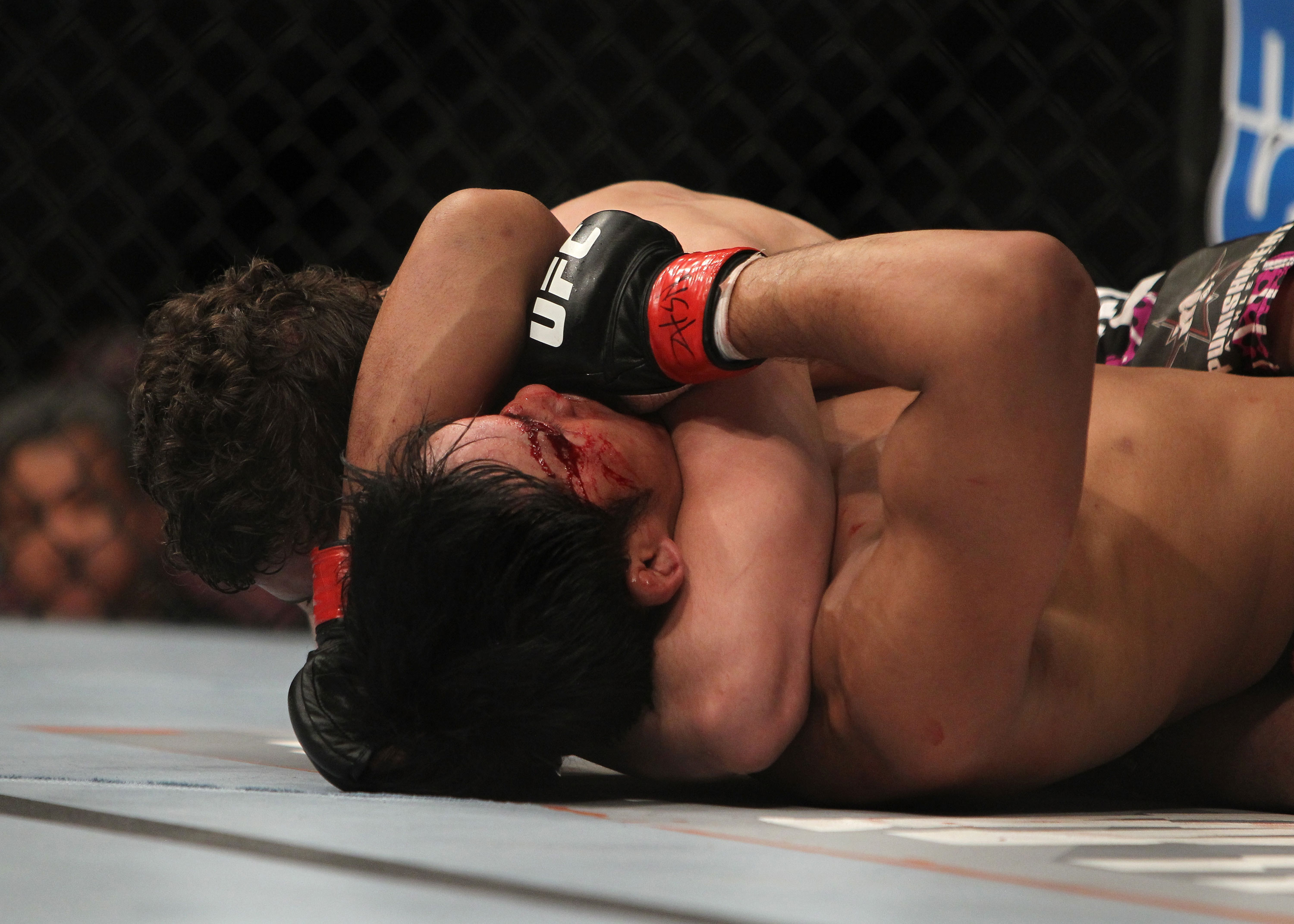 LAS VEGAS, NV - DECEMBER 30: Jimy Hettes (left) attempts to submit Nam Phan during the UFC 141 event at the MGM Grand Garden Arena on December 30, 2011 in Las Vegas, Nevada. (Photo by Josh Hedges/Zuffa LLC/Zuffa LLC via Getty Images) *** Local Caption *** Jimy Hettes; Nam Phan
