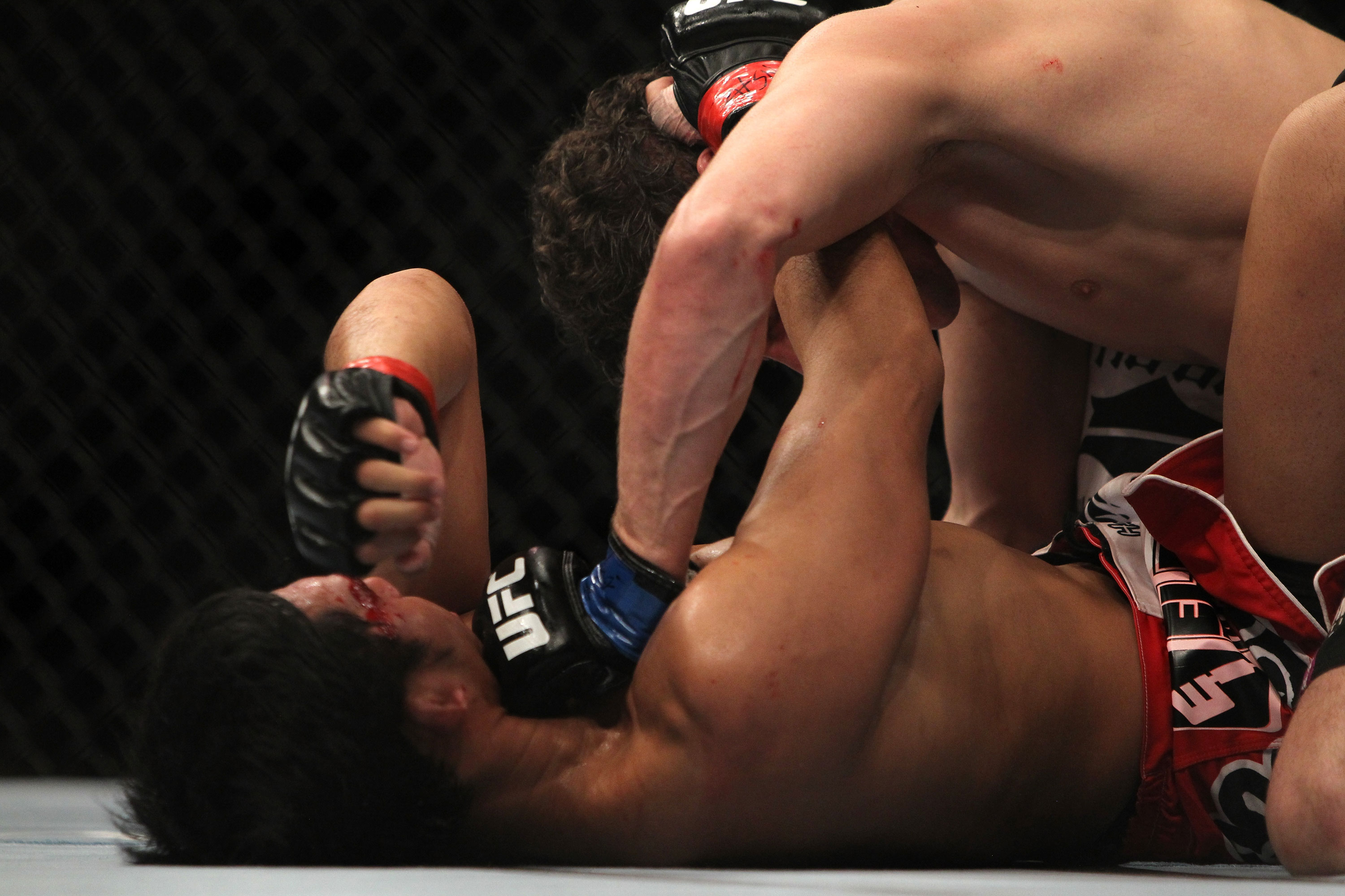LAS VEGAS, NV - DECEMBER 30: Jimy Hettes (top) punches Nam Phan during the UFC 141 event at the MGM Grand Garden Arena on December 30, 2011 in Las Vegas, Nevada. (Photo by Josh Hedges/Zuffa LLC/Zuffa LLC via Getty Images) *** Local Caption *** Jimy Hettes; Nam Phan
