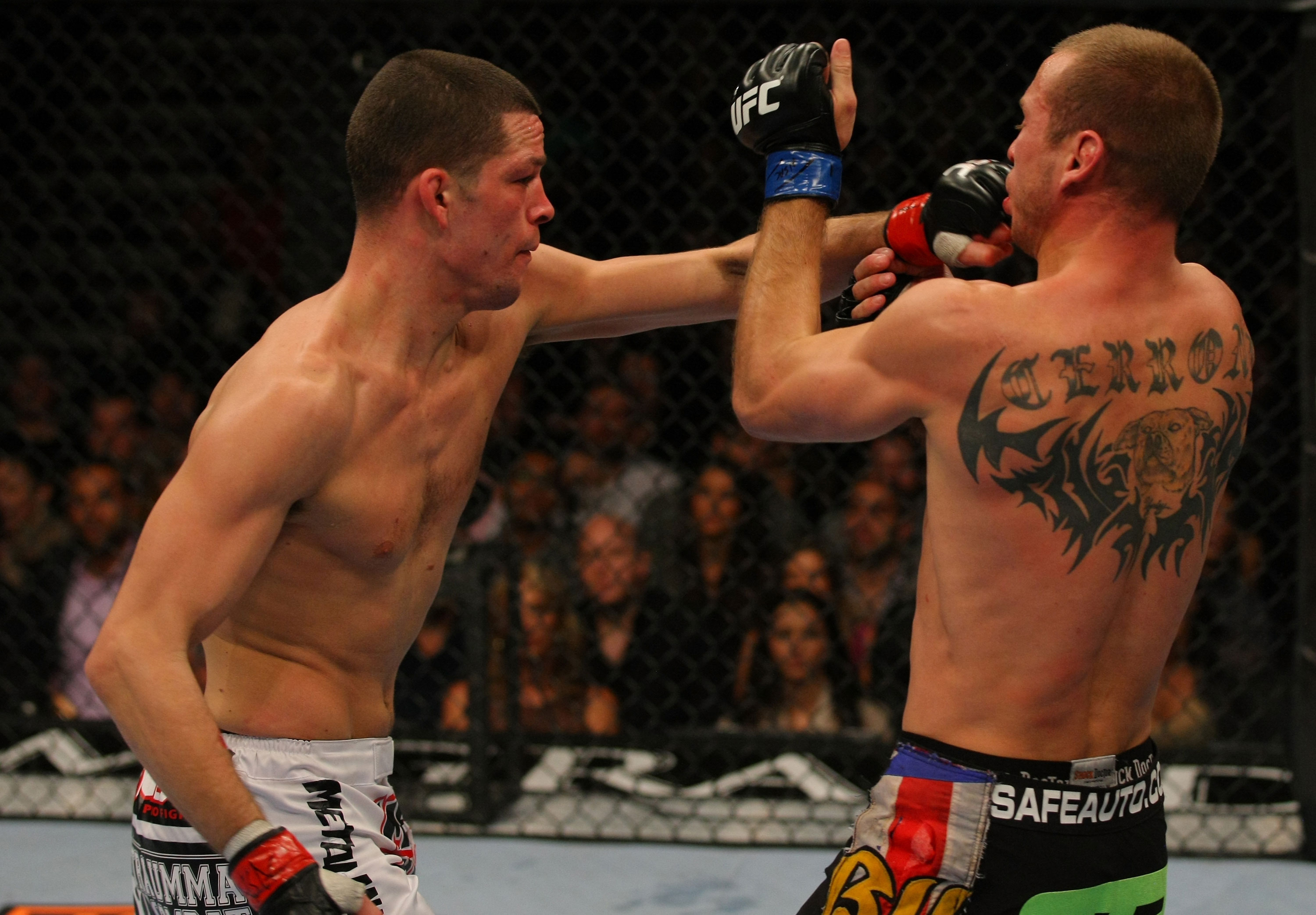 LAS VEGAS, NV - DECEMBER 30: Nate Diaz (left) punches Donald Cerrone (right) during the UFC 141 event at the MGM Grand Garden Arena on December 30, 2011 in Las Vegas, Nevada. (Photo by Donald Miralle/Zuffa LLC/Zuffa LLC via Getty Images) *** Local Caption *** Nate Diaz; Donald Cerrone