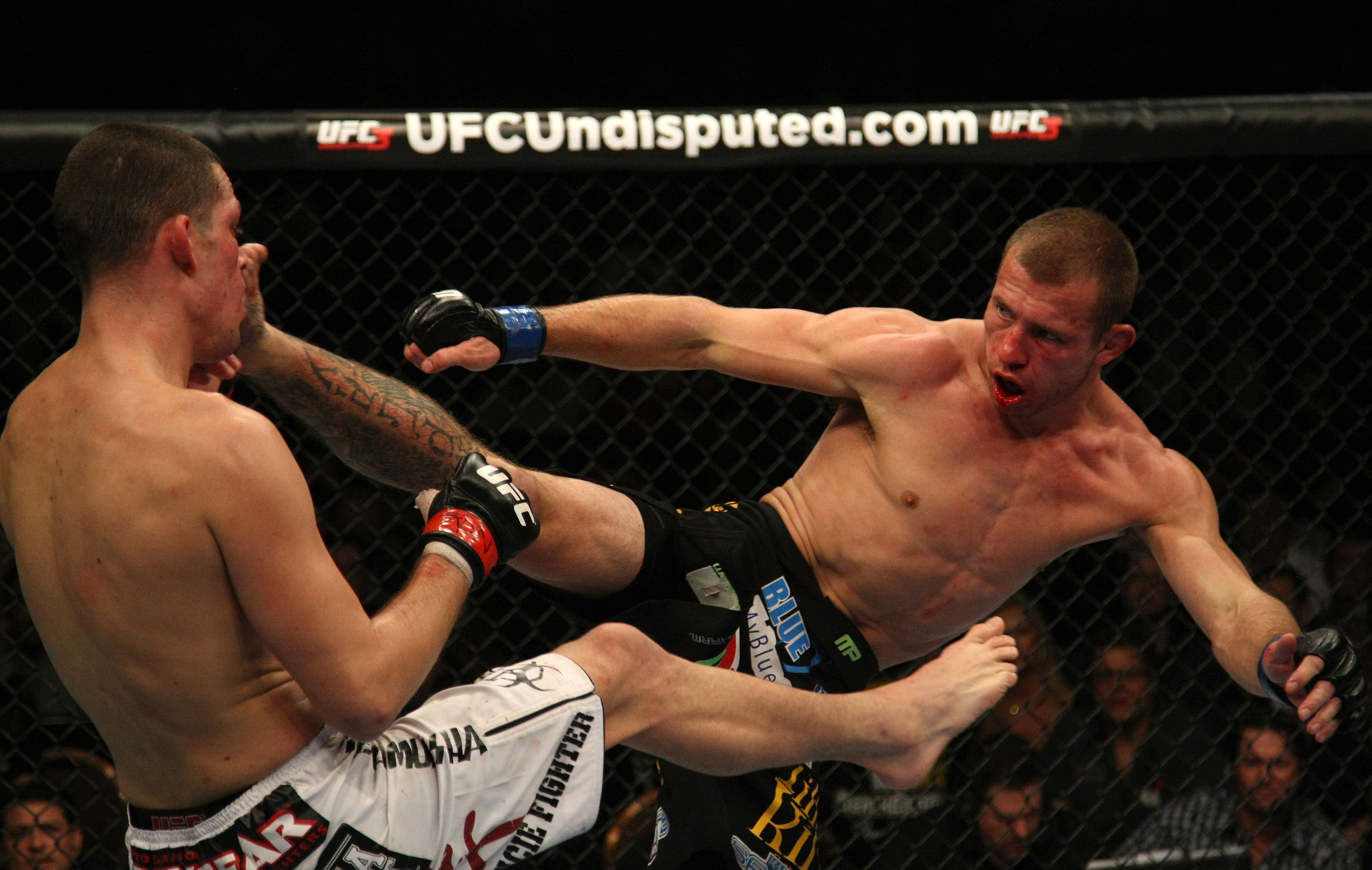 LAS VEGAS, NV - DECEMBER 30: Donald Cerrone (right) kicks Nate Diaz during the UFC 141 event at the MGM Grand Garden Arena on December 30, 2011 in Las Vegas, Nevada. (Photo by Donald Miralle/Zuffa LLC/Zuffa LLC via Getty Images) *** Local Caption *** Donald Cerrone; Nate Diaz
