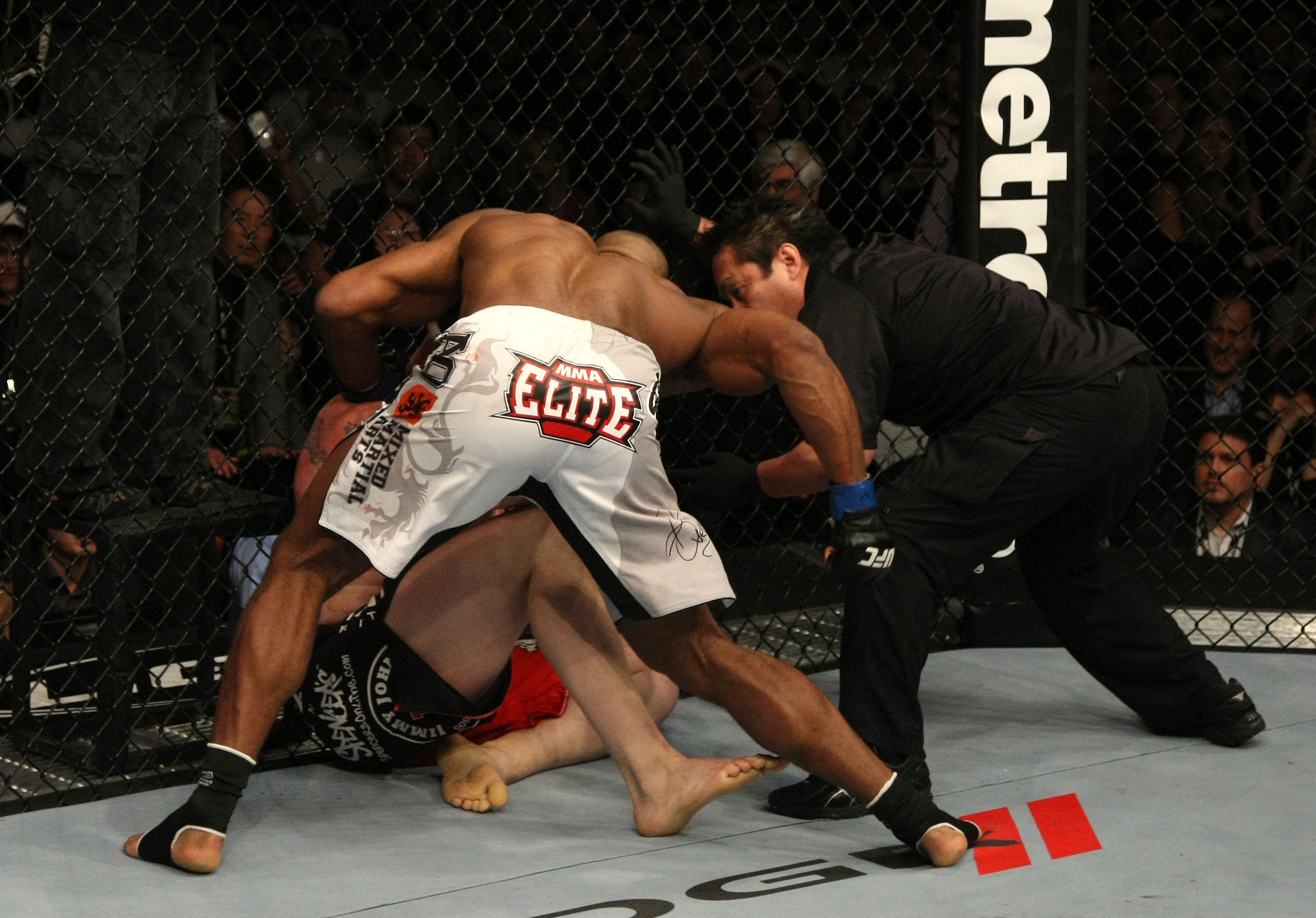 LAS VEGAS, NV - DECEMBER 30: Alistair Overeem (white shorts) punches Brock Lesnar during the UFC 141 event at the MGM Grand Garden Arena on December 30, 2011 in Las Vegas, Nevada. (Photo by Donald Miralle/Zuffa LLC/Zuffa LLC via Getty Images) *** Local Caption *** Alistair Overeem; Brock Lesnar