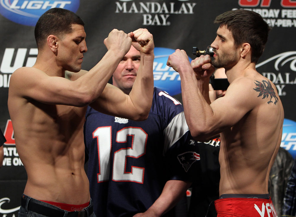 LAS VEGAS, NV - FEBRUARY 03: (L-R) Welterweight opponents Nick Diaz and Carlos Condit face off after weighing in during the UFC 143 official weigh in at Mandalay Bay Events Center on February 3, 2012 in Las Vegas, Nevada.|2:55:8 (Photo by Josh Hedges/Zuffa LLC/Zuffa LLC via Getty Images) *** Local Caption *** Nick Diaz; Carlos Condit