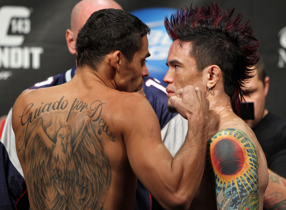 LAS VEGAS, NV - FEBRUARY 03: (L-R) Bantamweight opponents Renan Barao and Scott Jorgensen face off after weighing in during the UFC 143 official weigh in at Mandalay Bay Events Center on February 3, 2012 in Las Vegas, Nevada.|2:55:8 (Photo by Josh Hedges/Zuffa LLC/Zuffa LLC via Getty Images) *** Local Caption *** Renan Barao; Scott Jorgensen