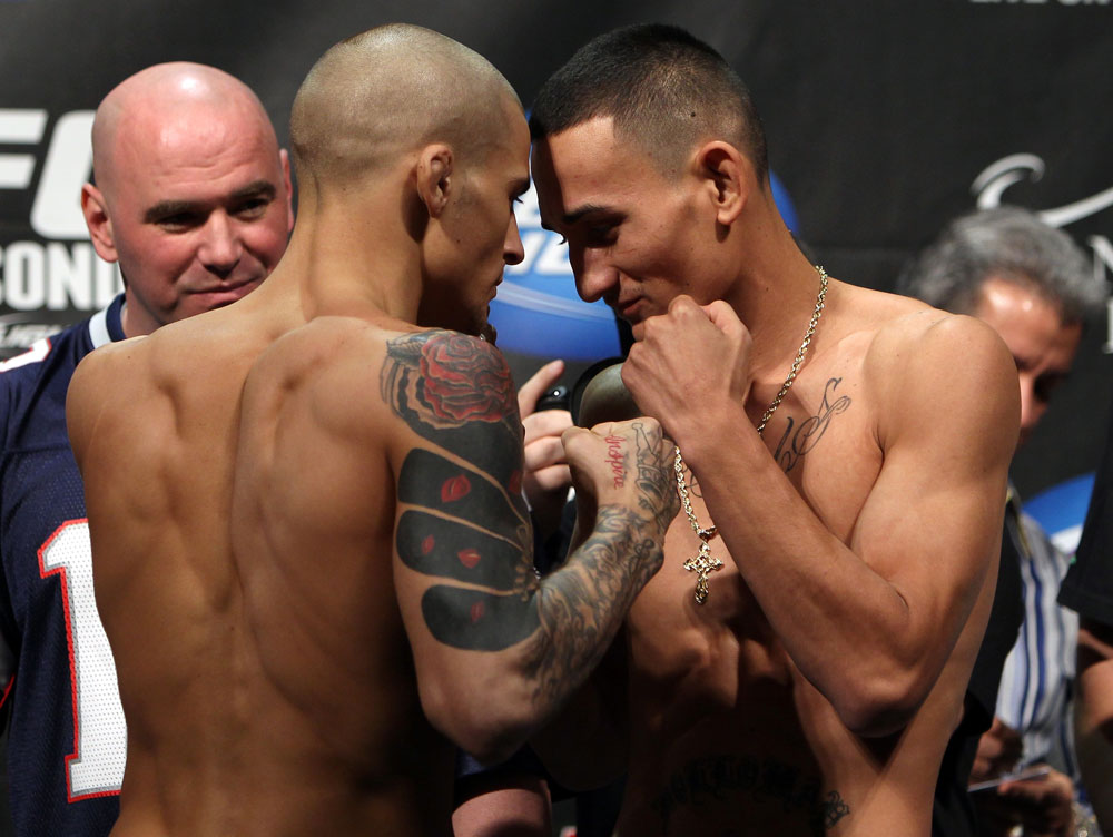 LAS VEGAS, NV - FEBRUARY 03: (L-R) Featherweight opponents Dustin Poirier and Max Holloway face off after weighing in during the UFC 143 official weigh in at Mandalay Bay Events Center on February 3, 2012 in Las Vegas, Nevada.|2:55:8 (Photo by Josh Hedges/Zuffa LLC/Zuffa LLC via Getty Images) *** Local Caption *** Dustin Poirier; Max Holloway