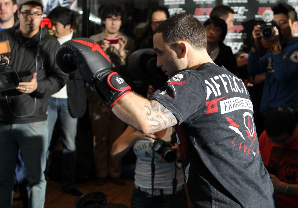 TOKYO, JAPAN - FEBRUARY 22: UFC Lightweight Champion Frankie Edgar works out for the media during the UFC 144 open workouts at Gold's Gym on February 22, 2012 in Tokyo, Japan. (Photo by Josh Hedges/Zuffa LLC/Zuffa LLC via Getty Images) *** Local Caption *** Frankie Edgar