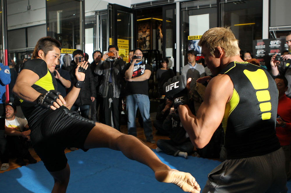 TOKYO, JAPAN - FEBRUARY 22: Yoshihiro Akiyama (R) and Dong Hyun Kim (L) work out for the media during the UFC 144 open workouts at Gold's Gym on February 22, 2012 in Tokyo, Japan. (Photo by Josh Hedges/Zuffa LLC/Zuffa LLC via Getty Images) *** Local Caption *** Yoshihiro Akiyama; Dong Hyun Kim