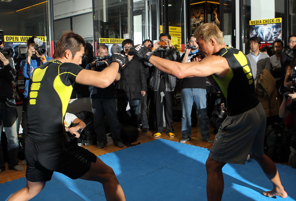 TOKYO, JAPAN - FEBRUARY 22: Yoshihiro Akiyama (R) and Dong Hyun Kim (L) work out for the media during the UFC 144 open workouts at Gold's Gym on February 22, 2012 in Tokyo, Japan. (Photo by Josh Hedges/Zuffa LLC/Zuffa LLC via Getty Images) *** Local Caption *** Yoshihiro Akiyama; Dong Hyun Kim