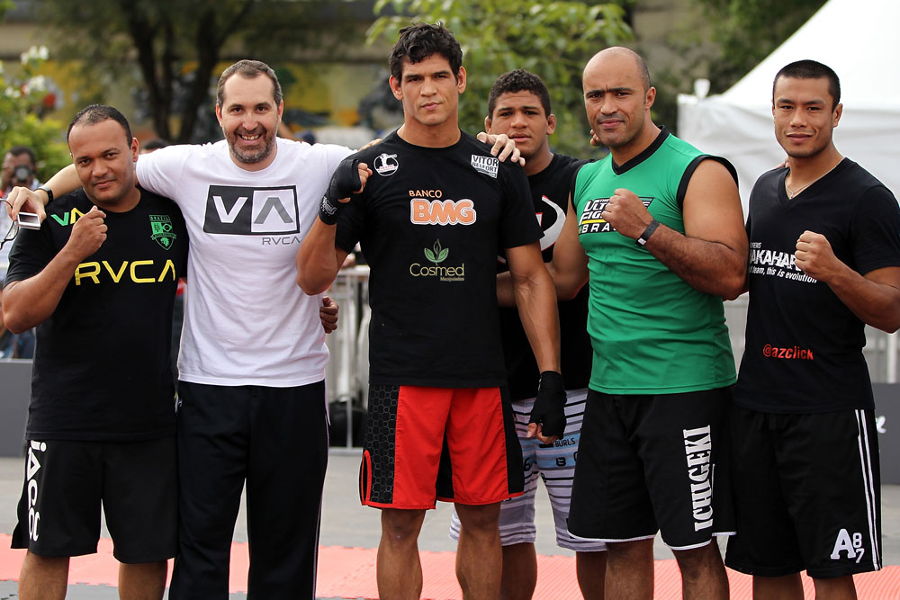 BELO HORIZONTE, BRAZIL - JUNE 20:   Cezar Ferreira (center) poses for a photo with his team during the UFC 147 open workouts at Praca da Estacao on June 20, 2012 in Belo Horizonte, Brazil.  (Photo by Josh Hedges/Zuffa LLC/Zuffa LLC via Getty Images)