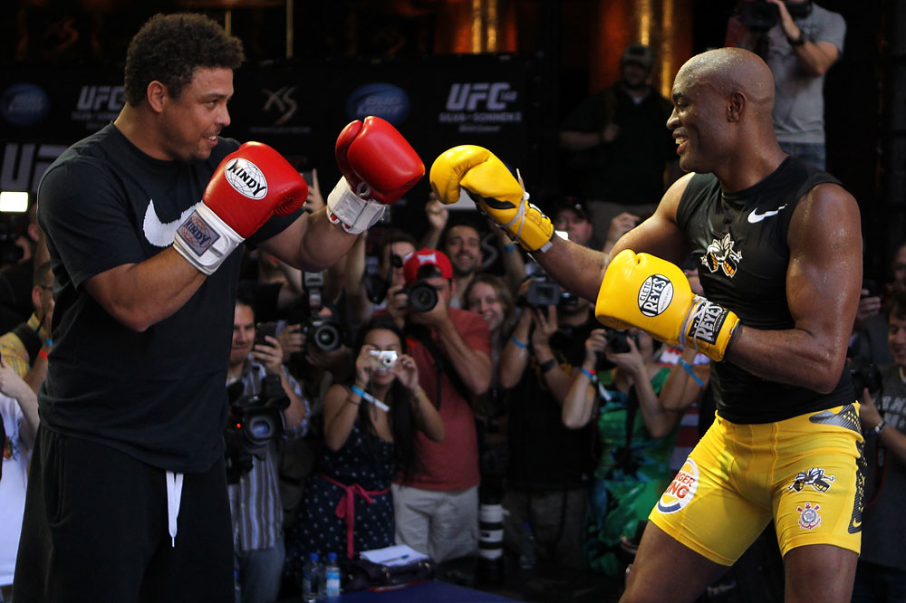 LAS VEGAS, NV - JULY 5: (R-L) UFC Middleweight Champion Anderson Silva spars with Brazilian soccer legend Ronaldo during the UFC 148 Open Workouts inside XS nightclub at the Encore on July 5, 2012 in Las Vegas, Nevada. (Photo by Josh Hedges/Zuffa LLC/Zuffa LLC via Getty Images)