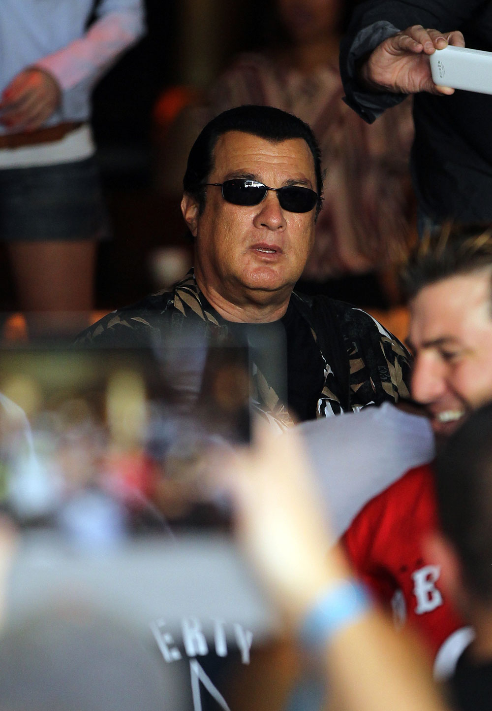LAS VEGAS, NV - JULY 5: Actor Steven Seagal looks on as Anderson Silva works out during the UFC 148 Open Workouts inside XS nightclub at the Encore on July 5, 2012 in Las Vegas, Nevada. (Photo by Josh Hedges/Zuffa LLC/Zuffa LLC via Getty Images)