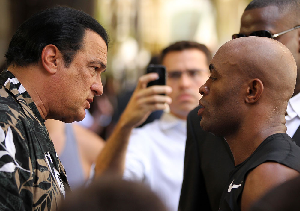LAS VEGAS, NV - JULY 5: (L-R) Actor Steven Seagal gives advice to Anderson Silva during the UFC 148 Open Workouts inside XS nightclub at the Encore on July 5, 2012 in Las Vegas, Nevada. (Photo by Josh Hedges/Zuffa LLC/Zuffa LLC via Getty Images)