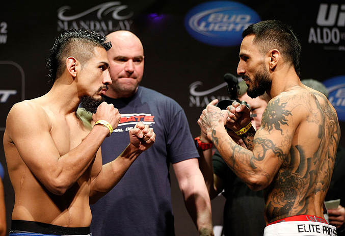 LAS VEGAS, NV - FEBRUARY 01:  (L-R) Opponents Edwin Figueroa and Francisco Rivera face off during the UFC 156 weigh-in on February 1, 2013 at Mandalay Bay Events Center in Las Vegas, Nevada.  (Photo by Josh Hedges/Zuffa LLC/Zuffa LLC via Getty Images)