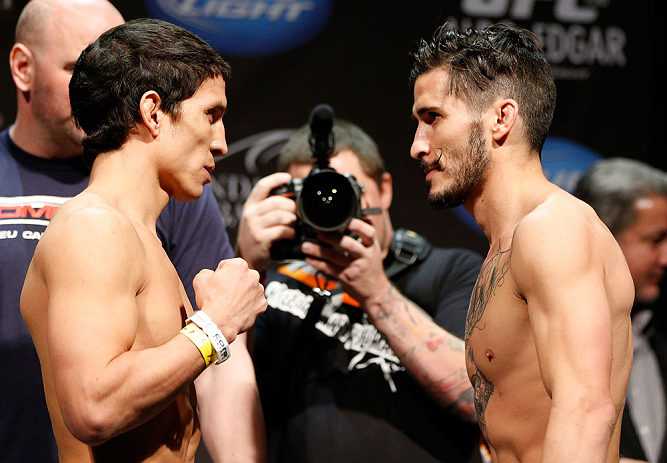 LAS VEGAS, NV - FEBRUARY 01:  (L-R) Opponents Joseph Benavidez and Ian McCall face off during the UFC 156 weigh-in on February 1, 2013 at Mandalay Bay Events Center in Las Vegas, Nevada.  (Photo by Josh Hedges/Zuffa LLC/Zuffa LLC via Getty Images)