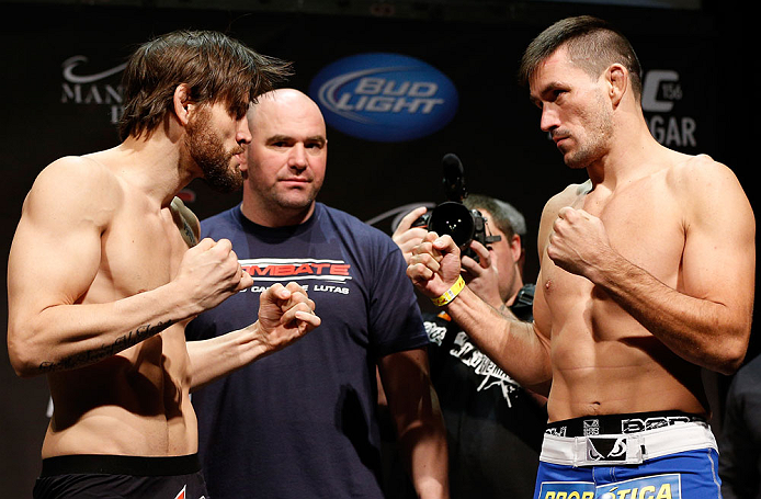 LAS VEGAS, NV - FEBRUARY 01:  (L-R) Opponents Jon Fitch and Demian Maia face off during the UFC 156 weigh-in on February 1, 2013 at Mandalay Bay Events Center in Las Vegas, Nevada.  (Photo by Josh Hedges/Zuffa LLC/Zuffa LLC via Getty Images)
