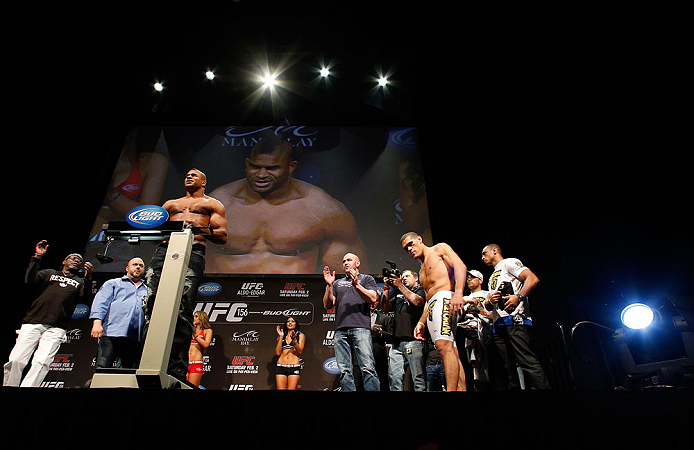 LAS VEGAS, NV - FEBRUARY 01:  Alistair Overeem weighs in as his opponent Antonio "Bigfoot" Silva looks on during the UFC 156 weigh-in on February 1, 2013 at Mandalay Bay Events Center in Las Vegas, Nevada.  (Photo by Josh Hedges/Zuffa LLC/Zuffa LLC via Getty Images)