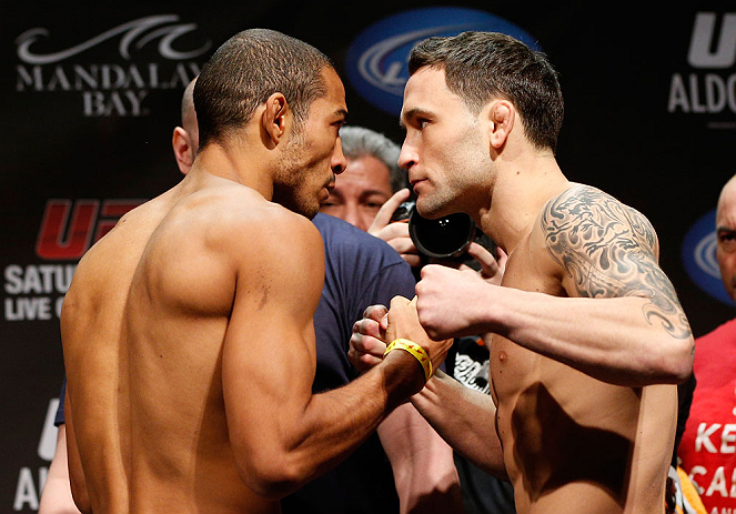 LAS VEGAS, NV - FEBRUARY 01:  (L-R) Opponents Jose Aldo and Frankie Edgar face off during the UFC 156 weigh-in on February 1, 2013 at Mandalay Bay Events Center in Las Vegas, Nevada.  (Photo by Josh Hedges/Zuffa LLC/Zuffa LLC via Getty Images)
