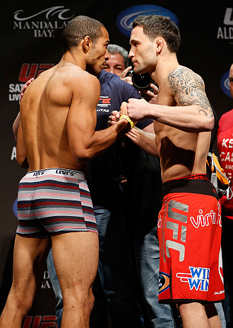 LAS VEGAS, NV - FEBRUARY 01:  (L-R) Opponents Jose Aldo and Frankie Edgar face off during the UFC 156 weigh-in on February 1, 2013 at Mandalay Bay Events Center in Las Vegas, Nevada.  (Photo by Josh Hedges/Zuffa LLC/Zuffa LLC via Getty Images)