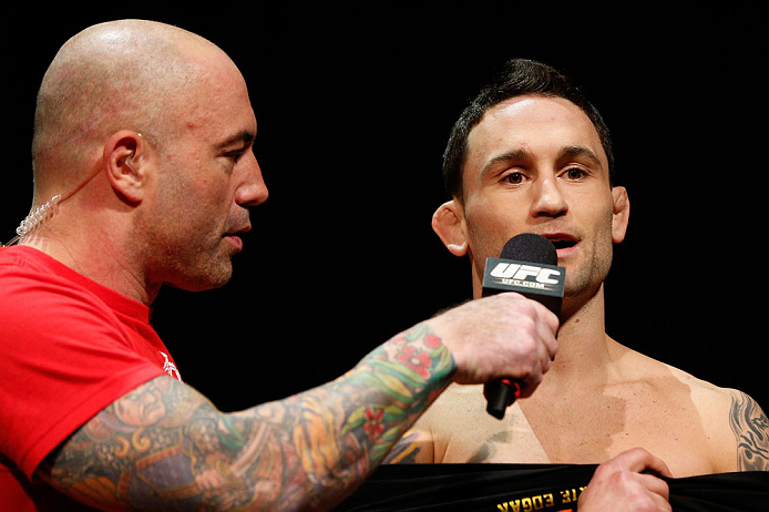 LAS VEGAS, NV - FEBRUARY 01:  (R-L) Frankie Edgar is interviewed by Joe Rogan during the UFC 156 weigh-in on February 1, 2013 at Mandalay Bay Events Center in Las Vegas, Nevada.  (Photo by Josh Hedges/Zuffa LLC/Zuffa LLC via Getty Images)