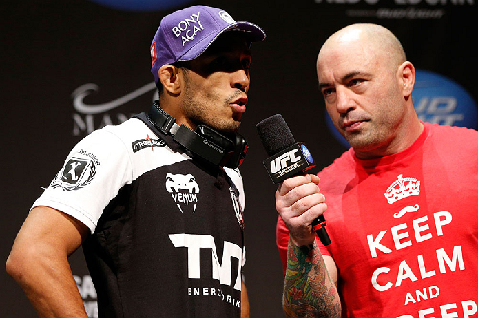 LAS VEGAS, NV - FEBRUARY 01:  (L-R) Jose Aldo is interviewed by Joe Rogan during the UFC 156 weigh-in on February 1, 2013 at Mandalay Bay Events Center in Las Vegas, Nevada.  (Photo by Josh Hedges/Zuffa LLC/Zuffa LLC via Getty Images)