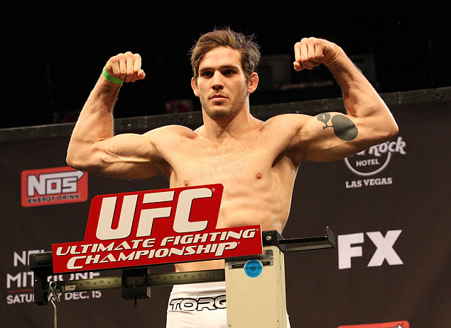 LAS VEGAS, NV - DECEMBER 14:  John Cofer steps onto the scale during TUF 16 Finale weigh in on December 14, 2012  at the Joint at the Hard Rock in Las Vegas, Nevada.  (Photo by Jim Kemper/Zuffa LLC/Zuffa LLC via Getty Images)
