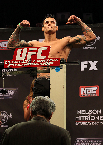 LAS VEGAS, NV - DECEMBER 14:  Reuben Duran steps onto the scale during TUF 16 Finale weigh in on December 14, 2012  at the Joint at the Hard Rock in Las Vegas, Nevada.  (Photo by Jim Kemper/Zuffa LLC/Zuffa LLC via Getty Images)