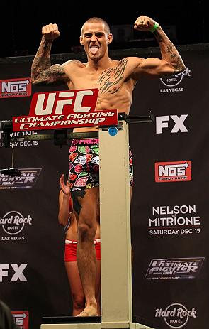 LAS VEGAS, NV - DECEMBER 14:  Dustin Poirier poses on the scale during TUF 16 Finale weigh in on December 14, 2012  at the Joint at the Hard Rock in Las Vegas, Nevada.  (Photo by Jim Kemper/Zuffa LLC/Zuffa LLC via Getty Images)