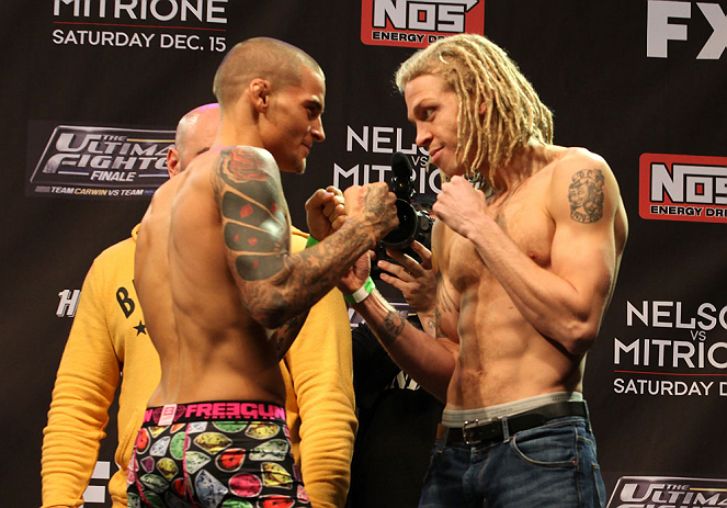 LAS VEGAS, NV - DECEMBER 14:  (L-R) Dustin Poirier and Jonathan Brookins face off during TUF 16 Finale weigh in on December 14, 2012  at the Joint at the Hard Rock in Las Vegas, Nevada.  (Photo by Jim Kemper/Zuffa LLC/Zuffa LLC via Getty Images)
